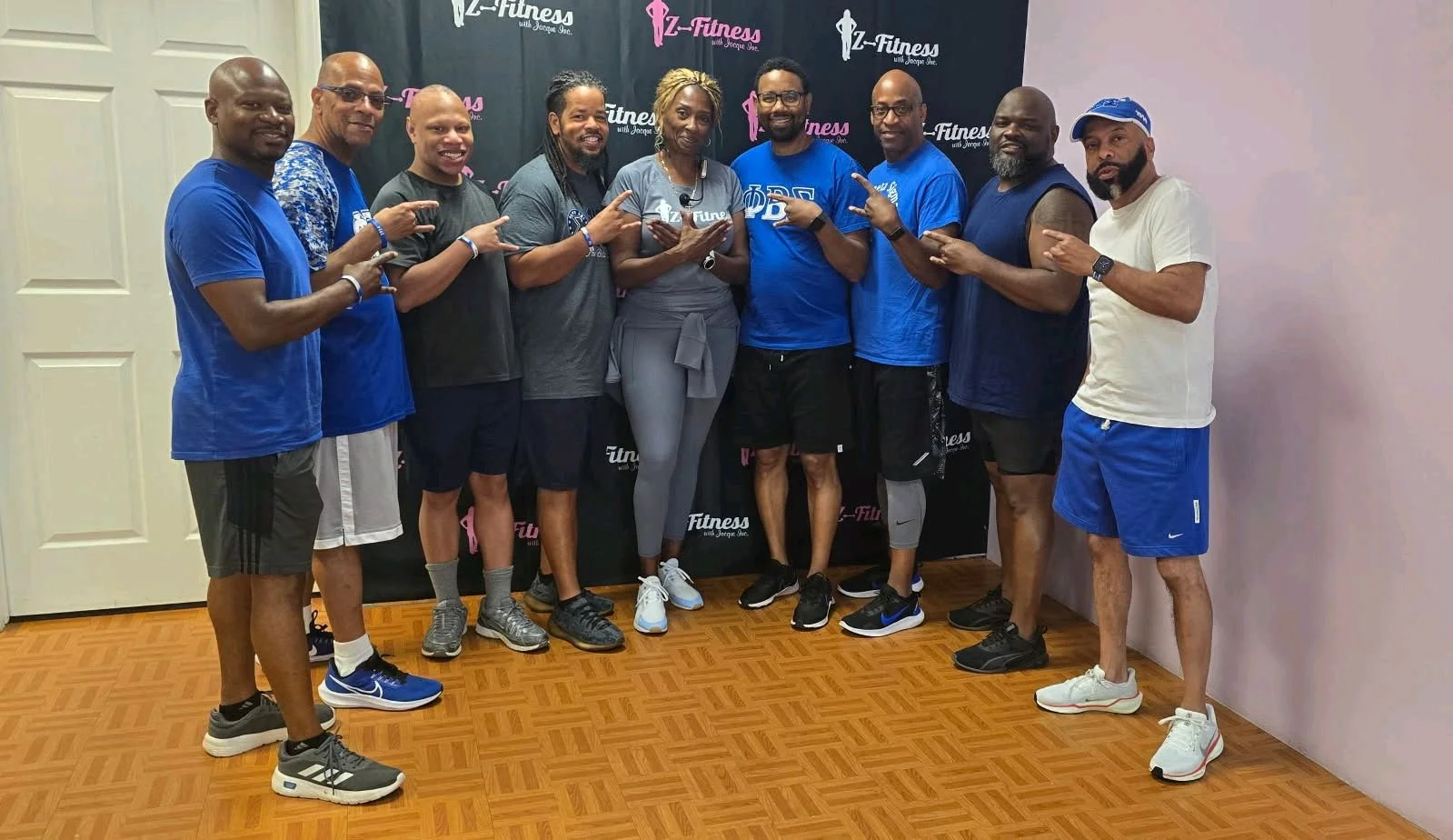 Fraternity brothers and guests posing for a picture after a workout at 'Z-Fitness' in Raleigh, NC.