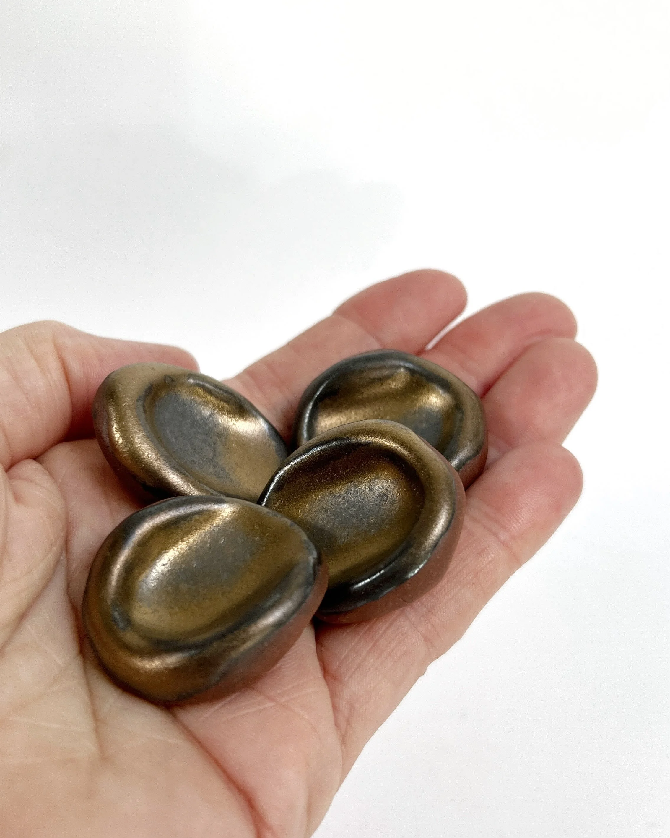 It&rsquo;s been a little while between posts but I&rsquo;m back and have been busy making more little grounding stones, with some new colours too! Introducing the &lsquo;gold&rsquo; glaze, to add a little magic to your day! ✨  #groundingstones #worry