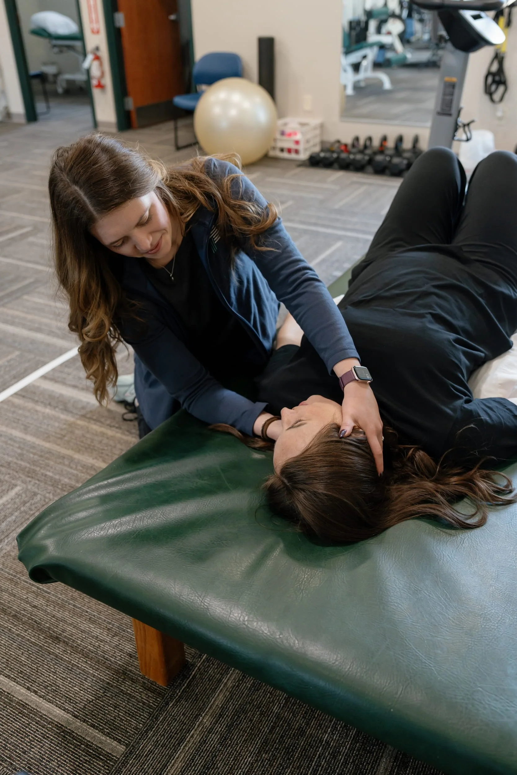 Physical therapist working on a patient's neck