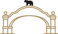 Gold-colored bridge with decorative pillars and arches
