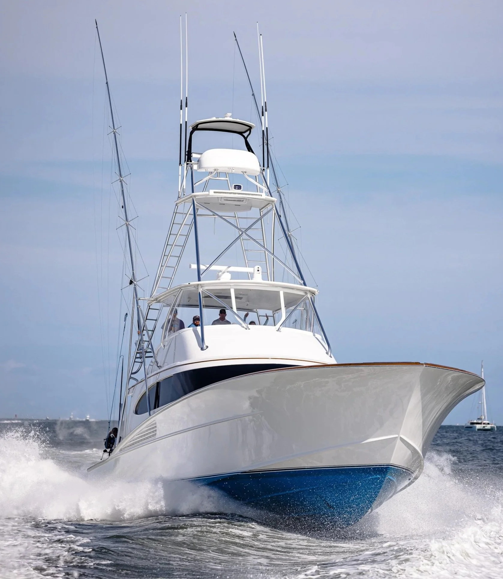 Sportfishing boat photographed at the waterline, showcasing the hull, profile, and offshore-ready design against open water.
