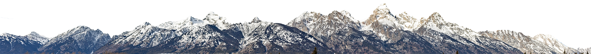 Snow-capped mountain range with sharp peaks under a clear sky.