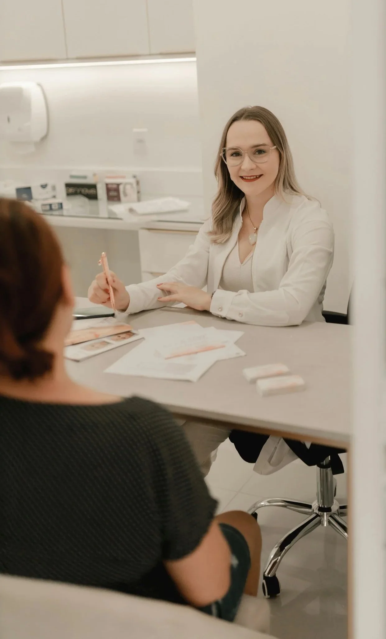 two ladies discussing dental visit