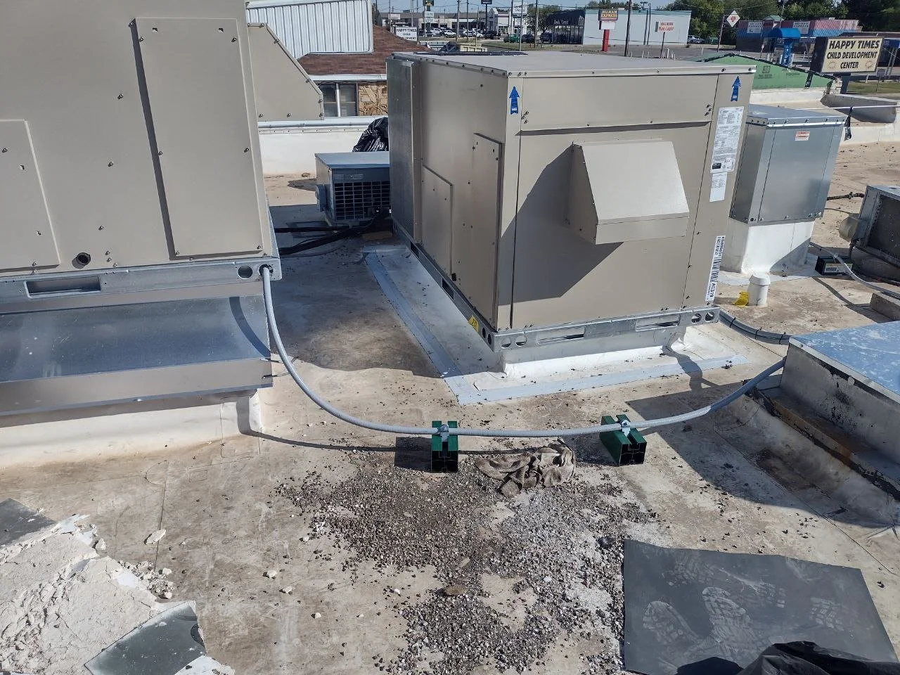 Commercial rooftop HVAC units installed for heating and air conditioning in the Oklahoma City area