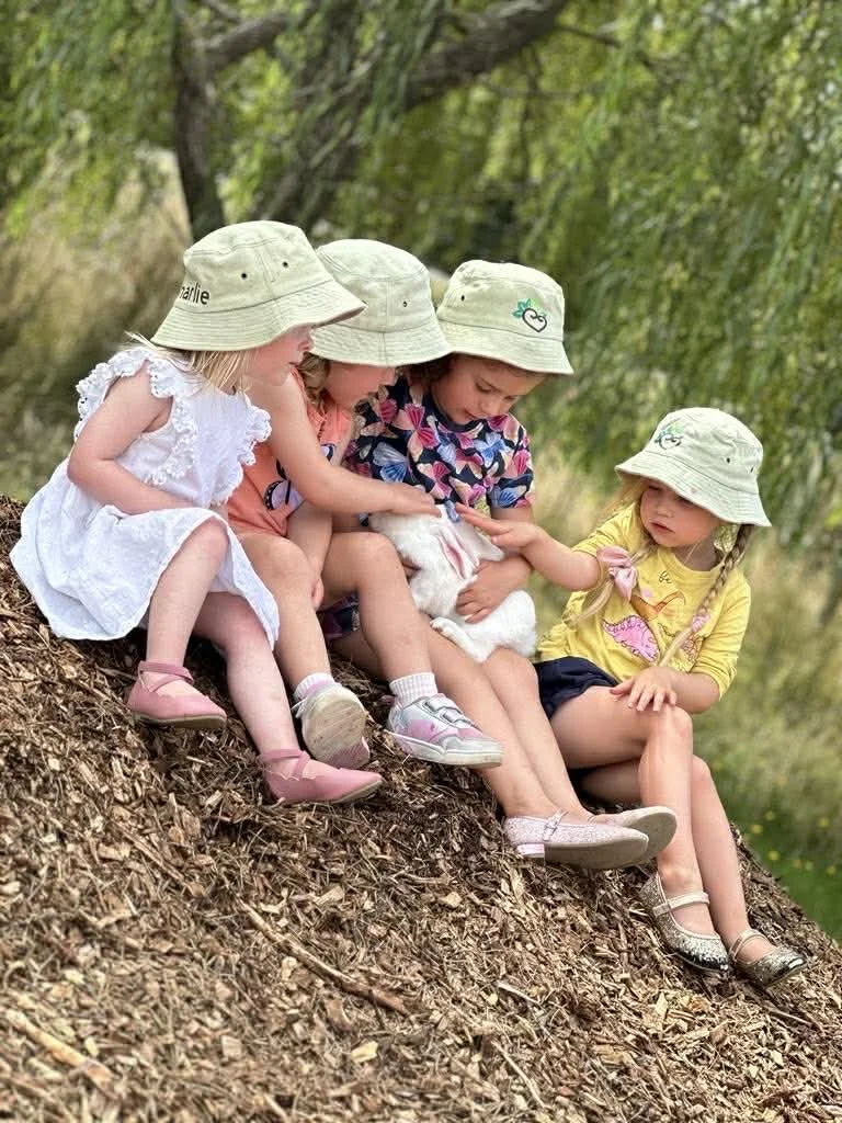Children playing outdoors at Country Wonders childcare centre in Loburn
