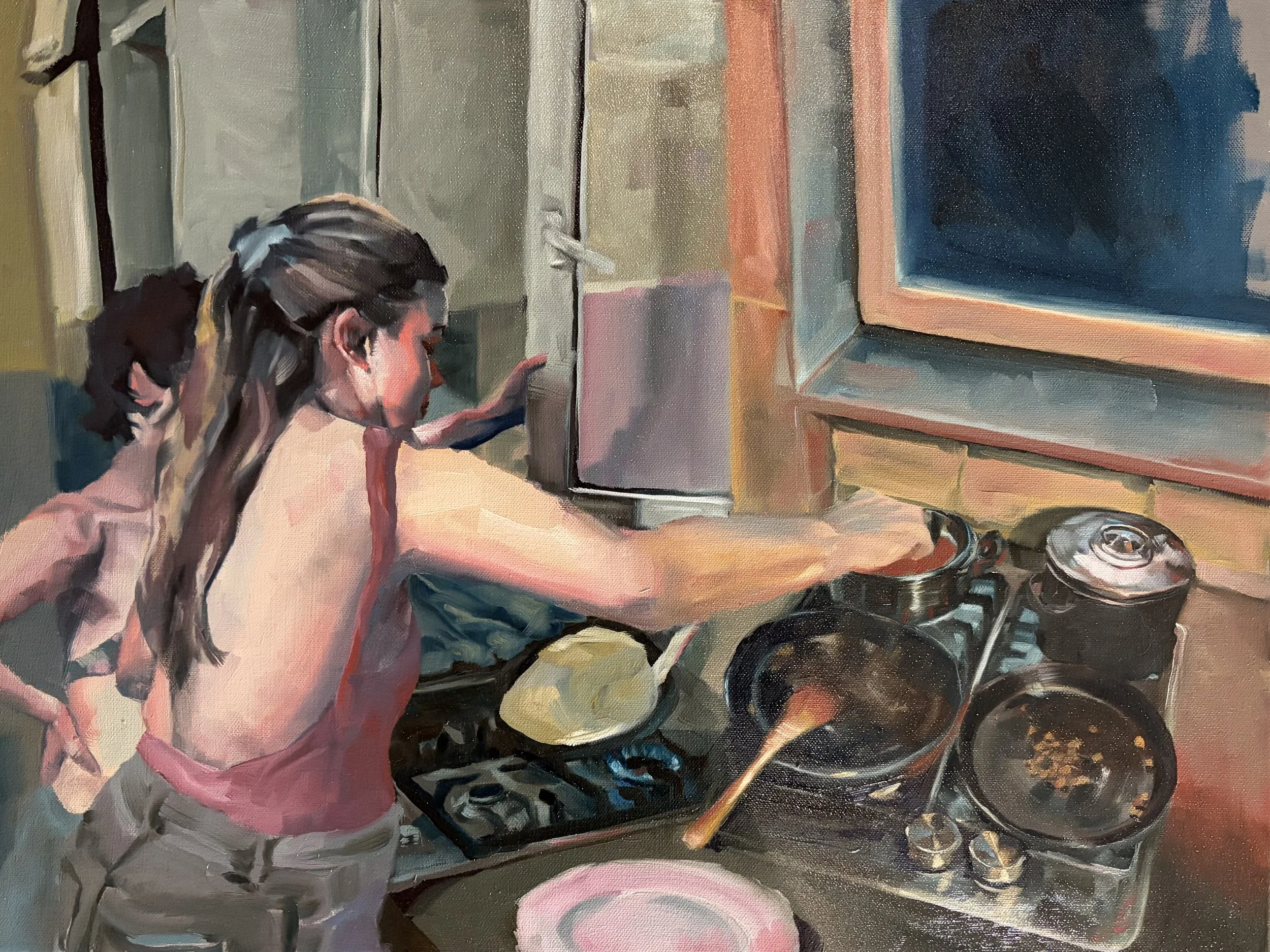 A young woman wearing a pink apron is cooking on a stove, stirring a pot, with her hair tied back. A child stands beside her, watching. The kitchen has a brick wall and a large black screen or TV on the wall.