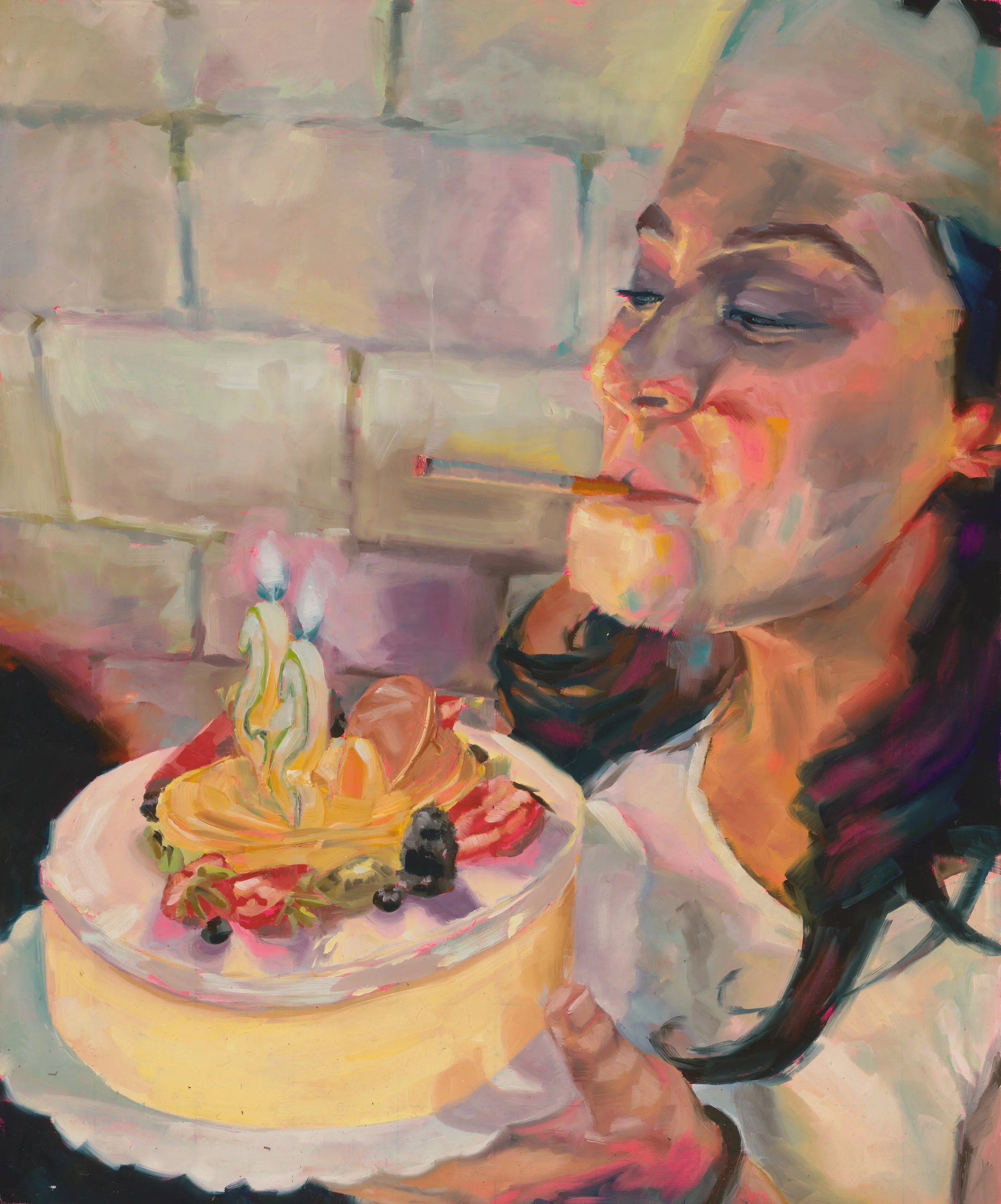 A woman in a chef's hat holding a cake with candles, decorated with berries and fruit.