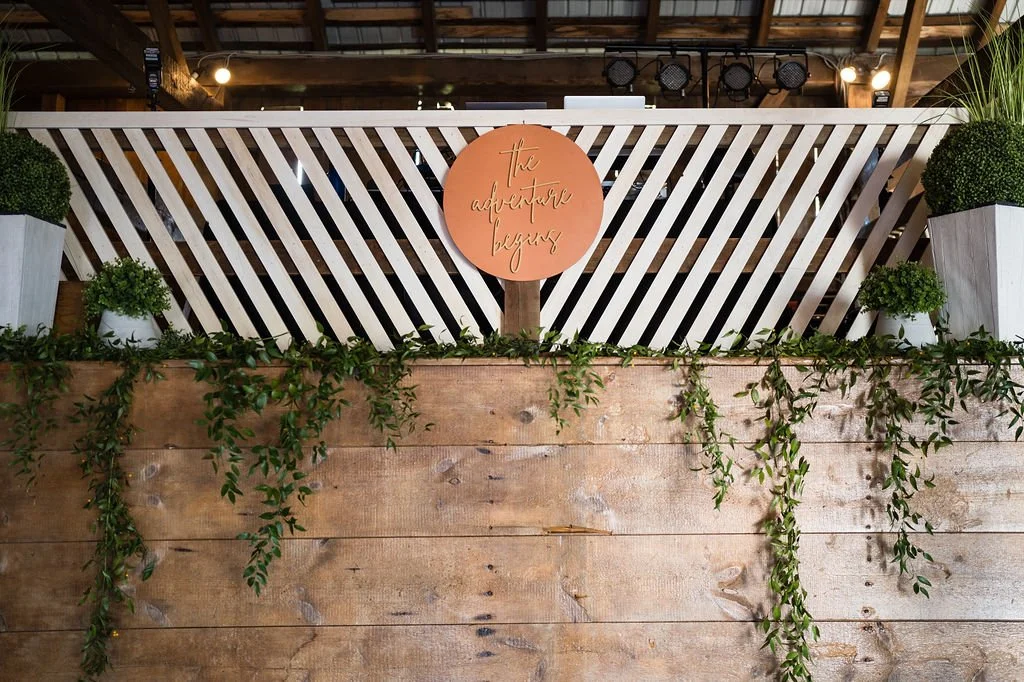 “The Adventure Begins” Sign