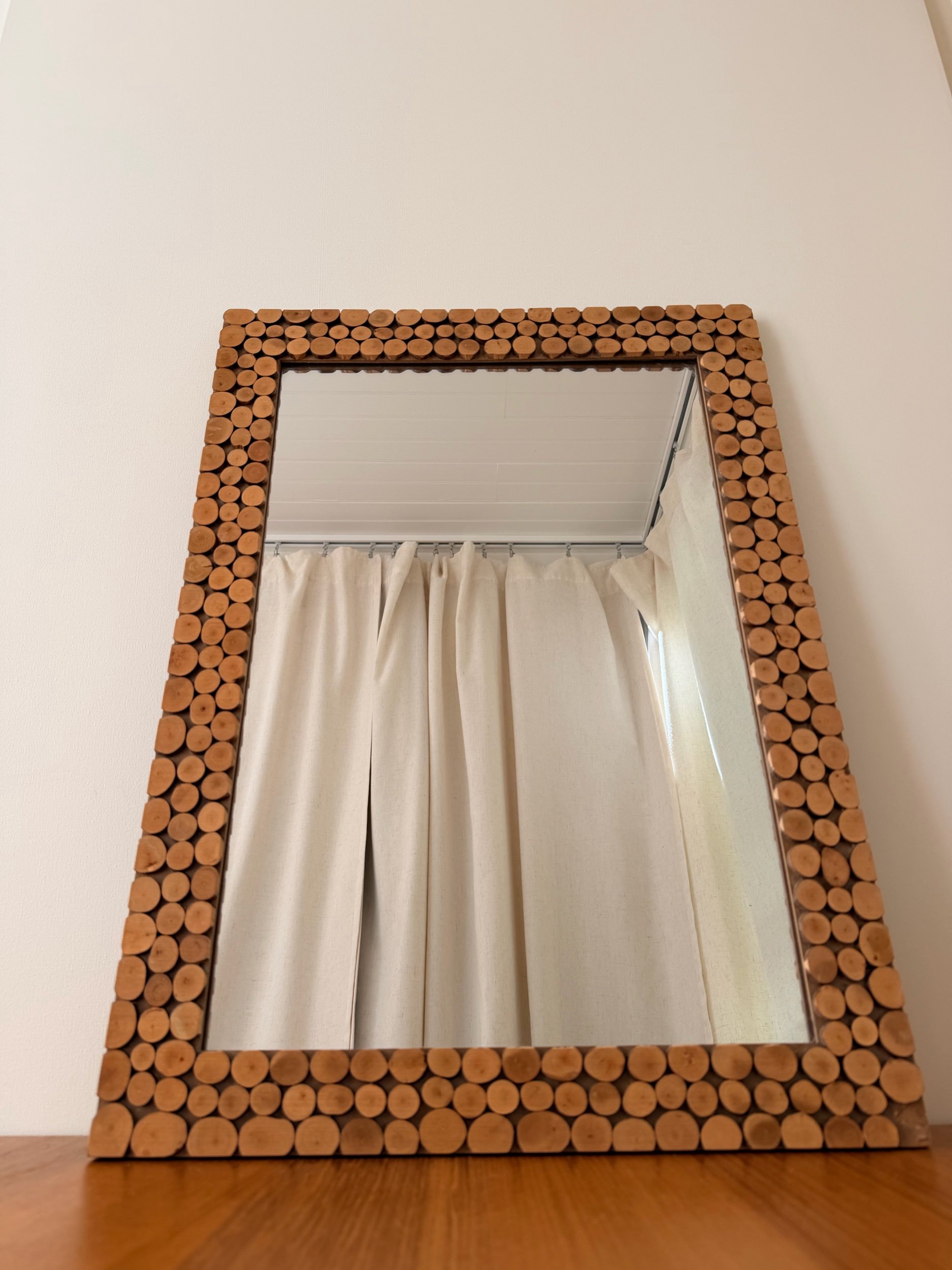 round wood pieces rectangular mirror