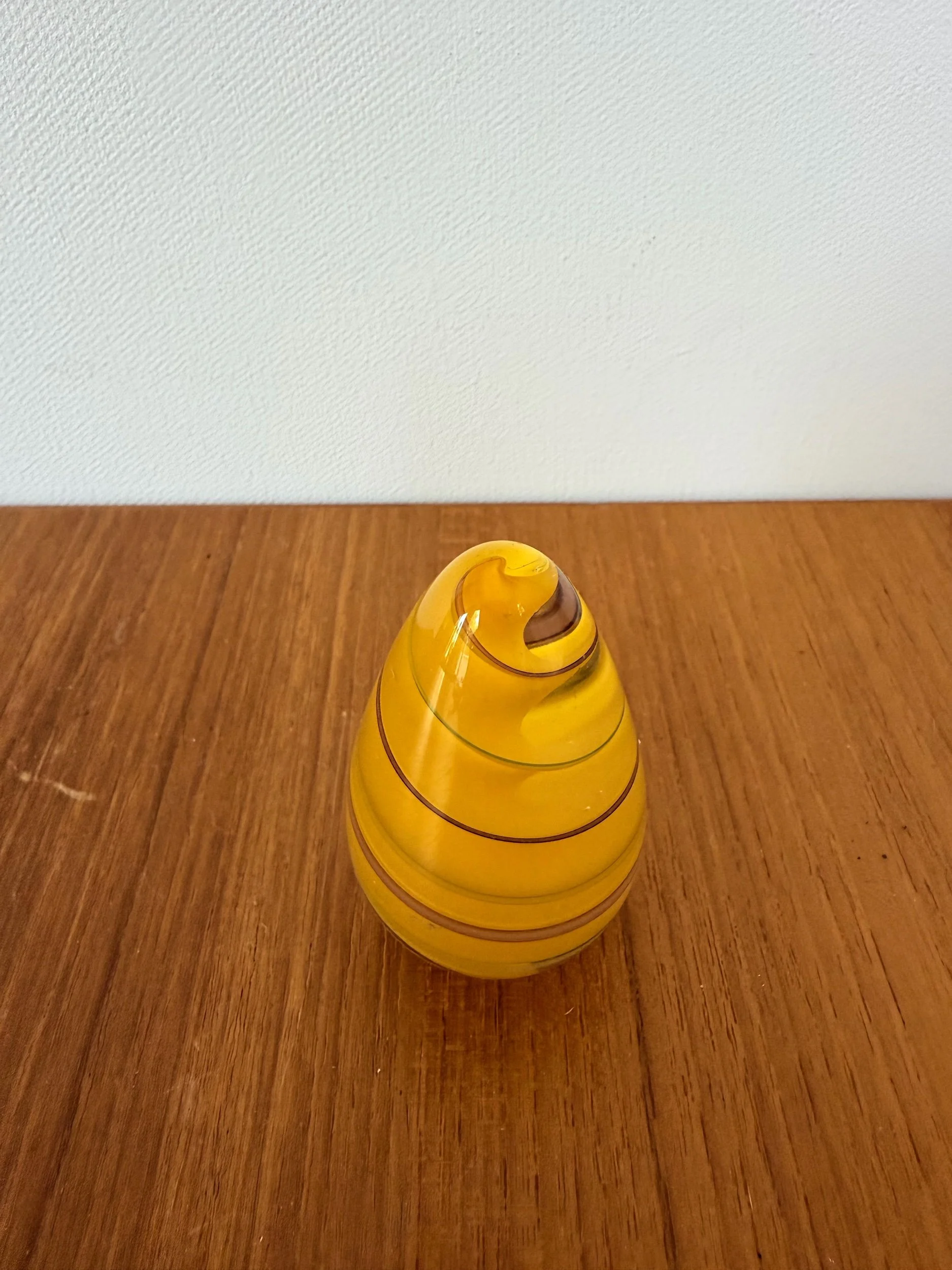 yellow glass paperweight
