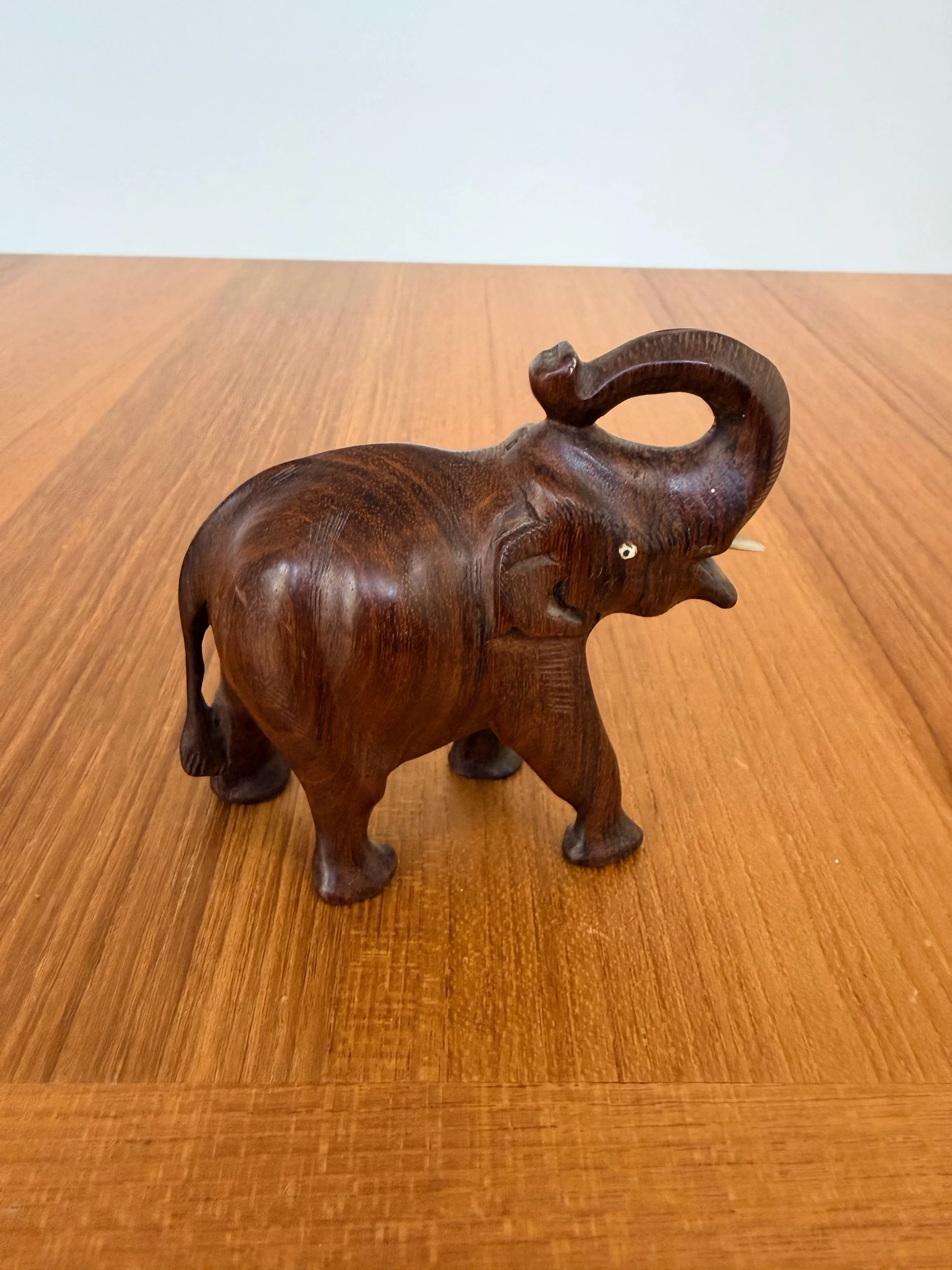 wood elephant with tusks