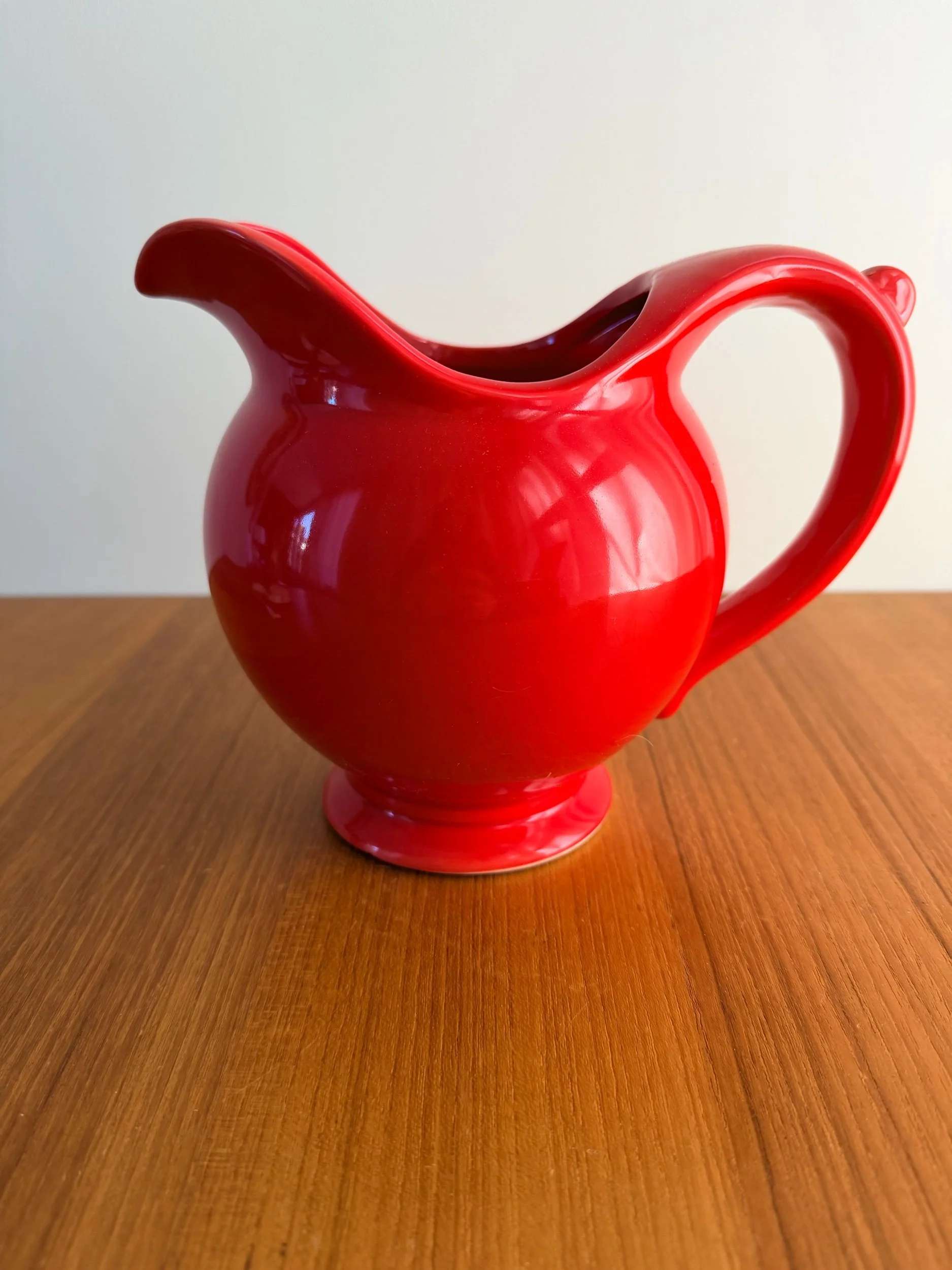 red pedestal pitcher