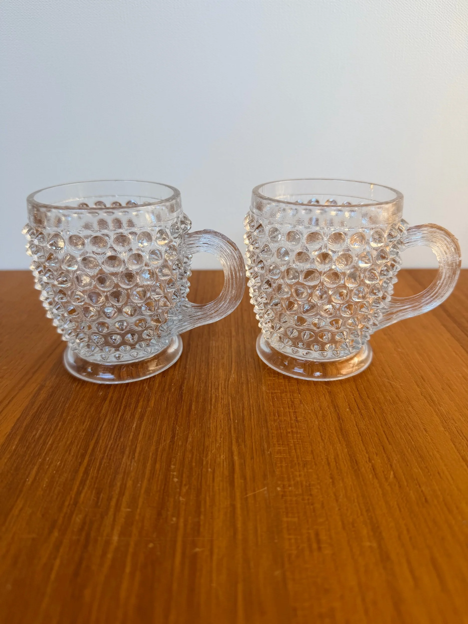 pair of vintage hobnail glass mugs