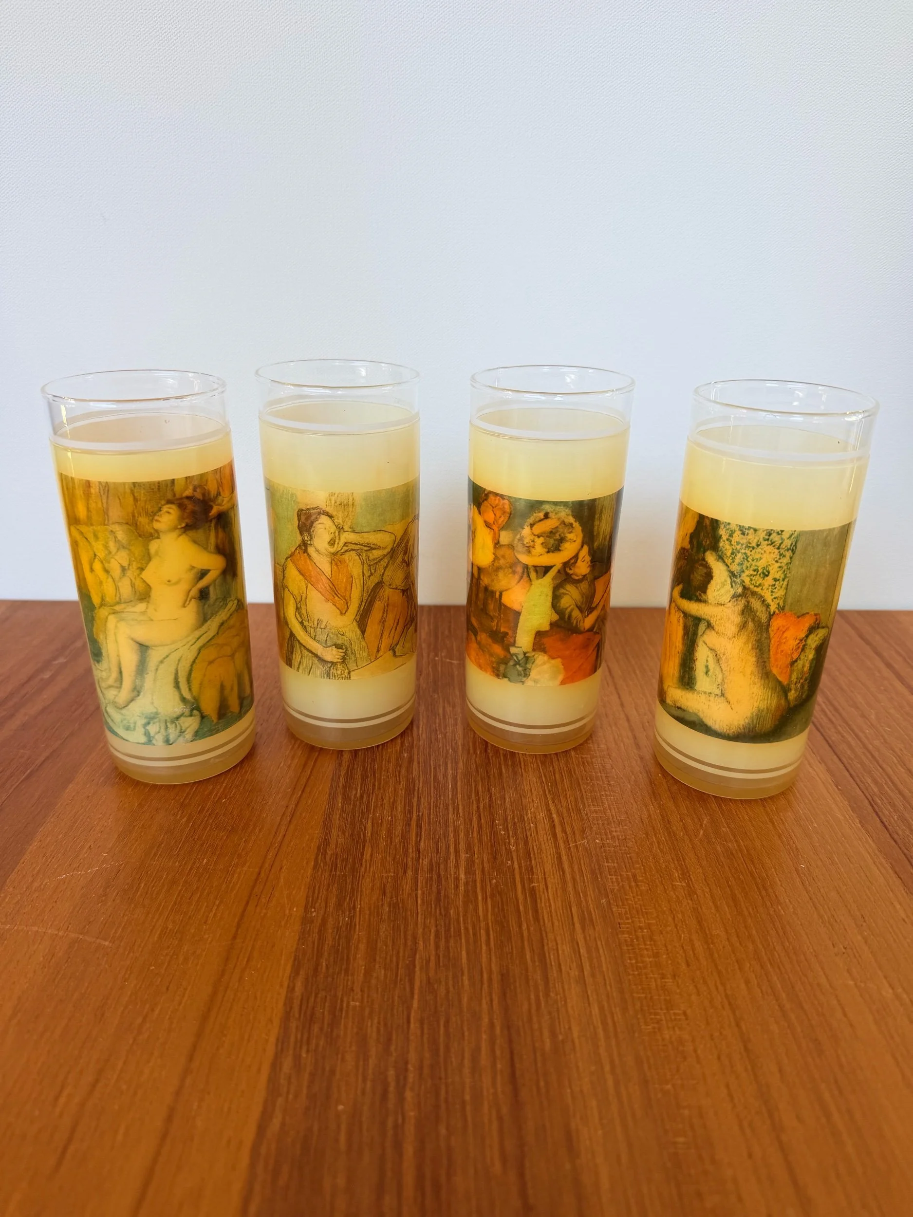 4 glasses with wax paintings of women