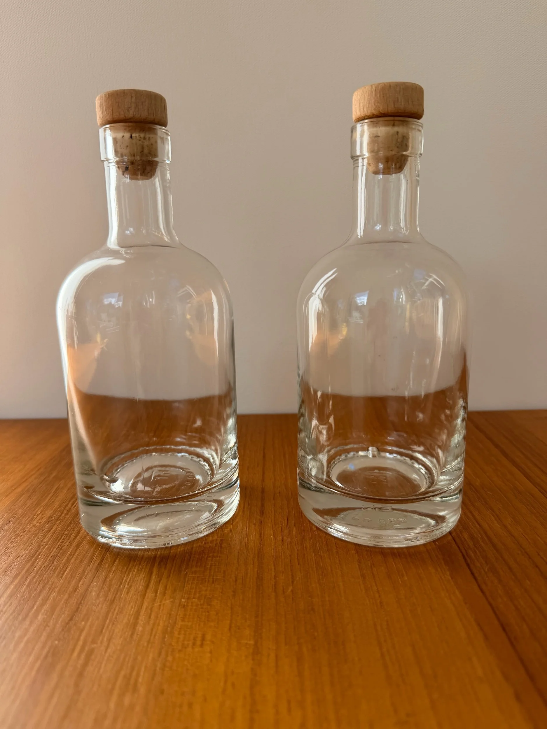 2 glass bottles with stoppers