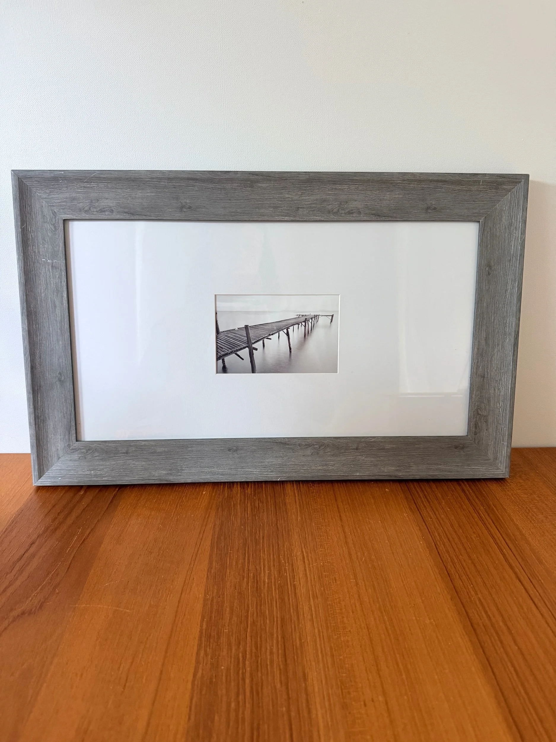 black & white photograph of pier