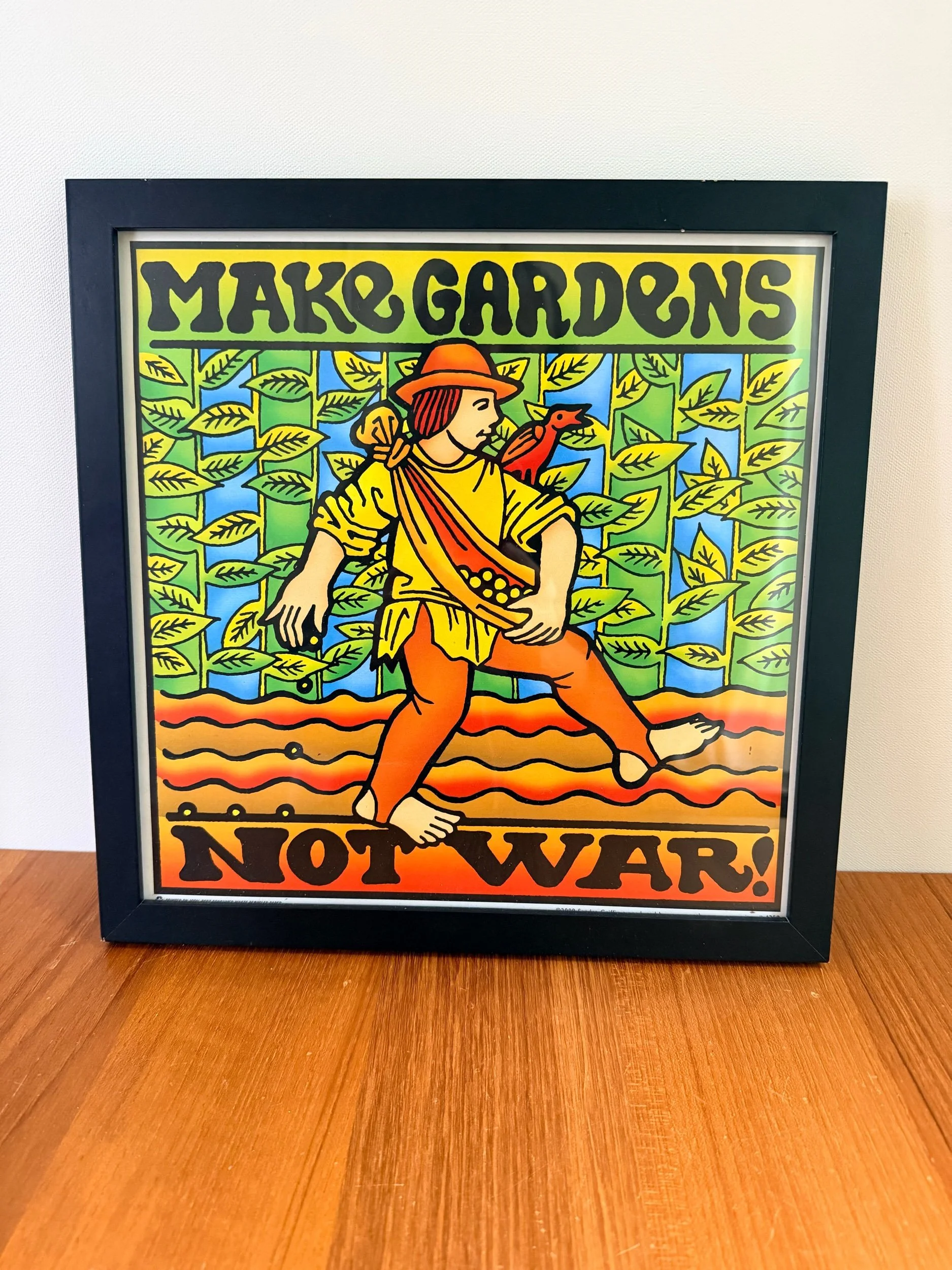 make gardens not war framed print