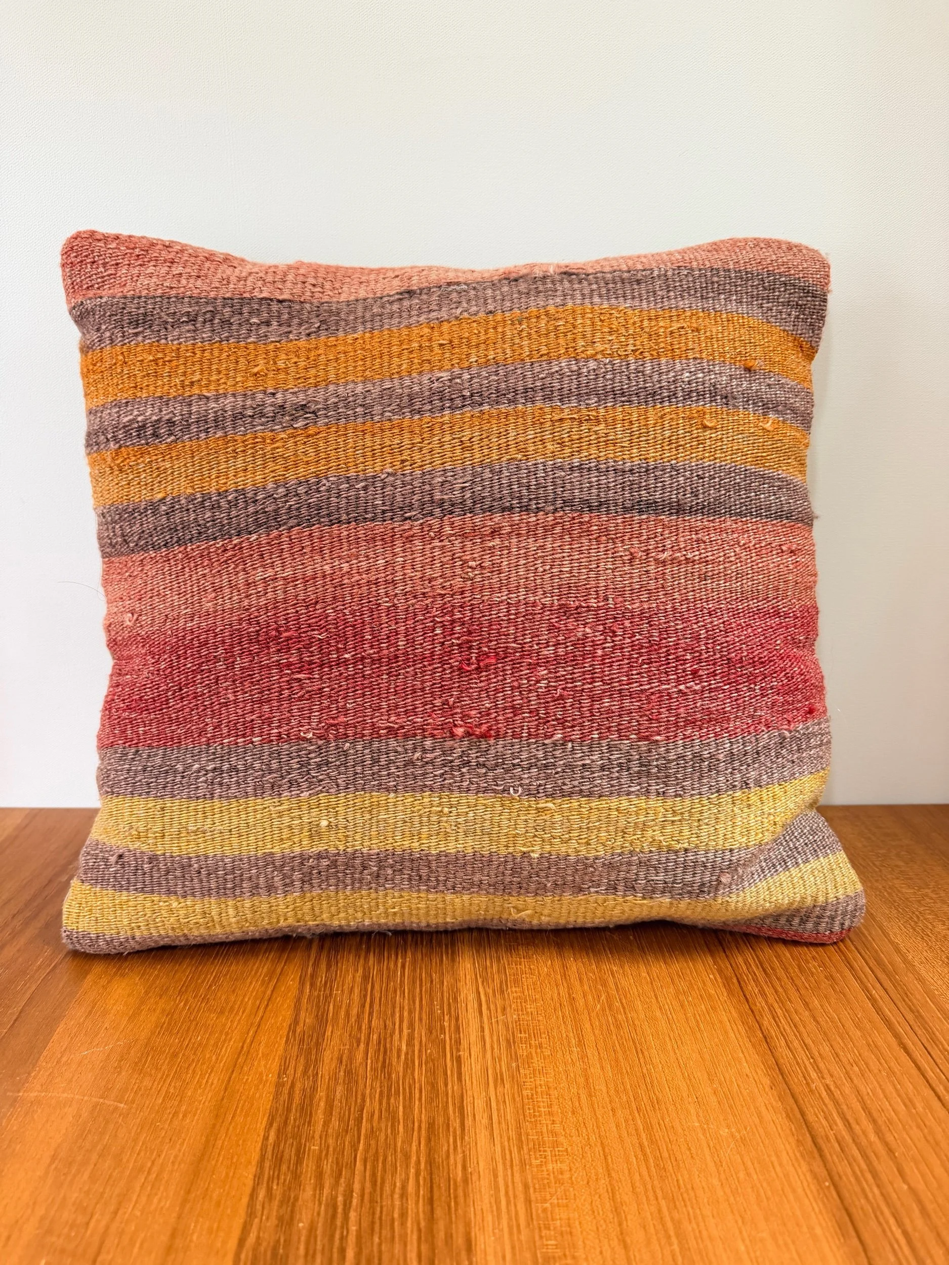 red / orange / yellow striped wool pillow