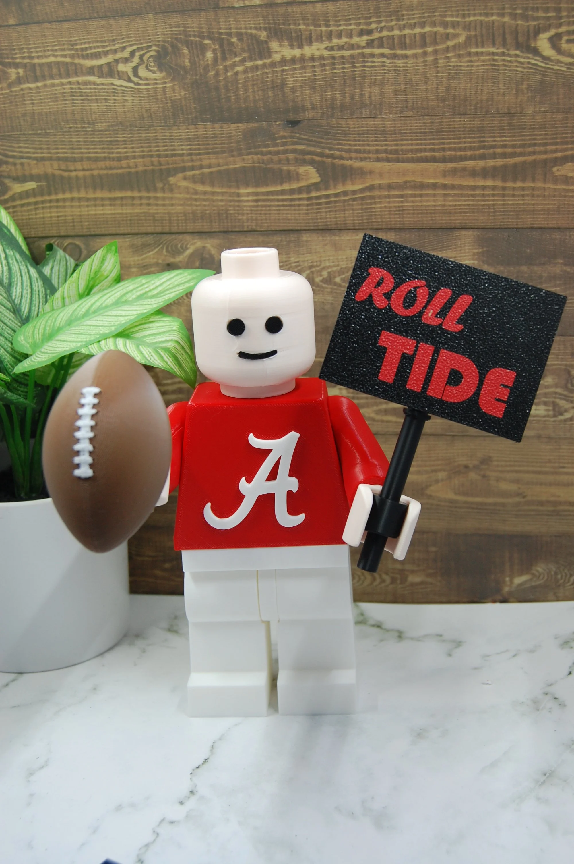 Oversized football fan brick figure with team inspired colors and collectible display design