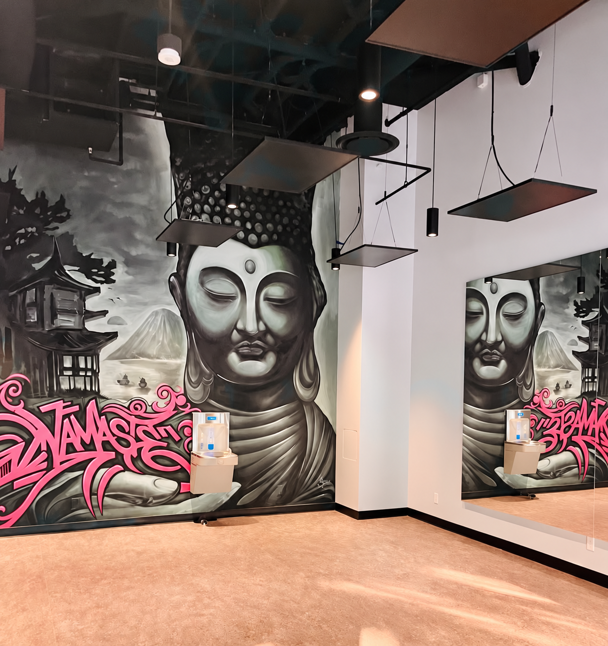 Serene Buddha Mural with Pink Namaste Graffiti.png