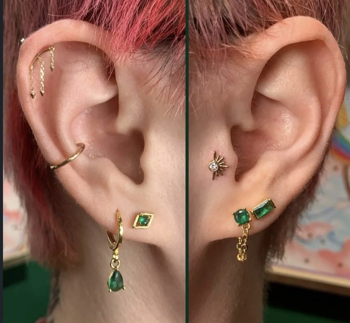 Close-up view of a person's ears featuring multiple earrings with green gemstones and gold details, some with chains or decorative elements.