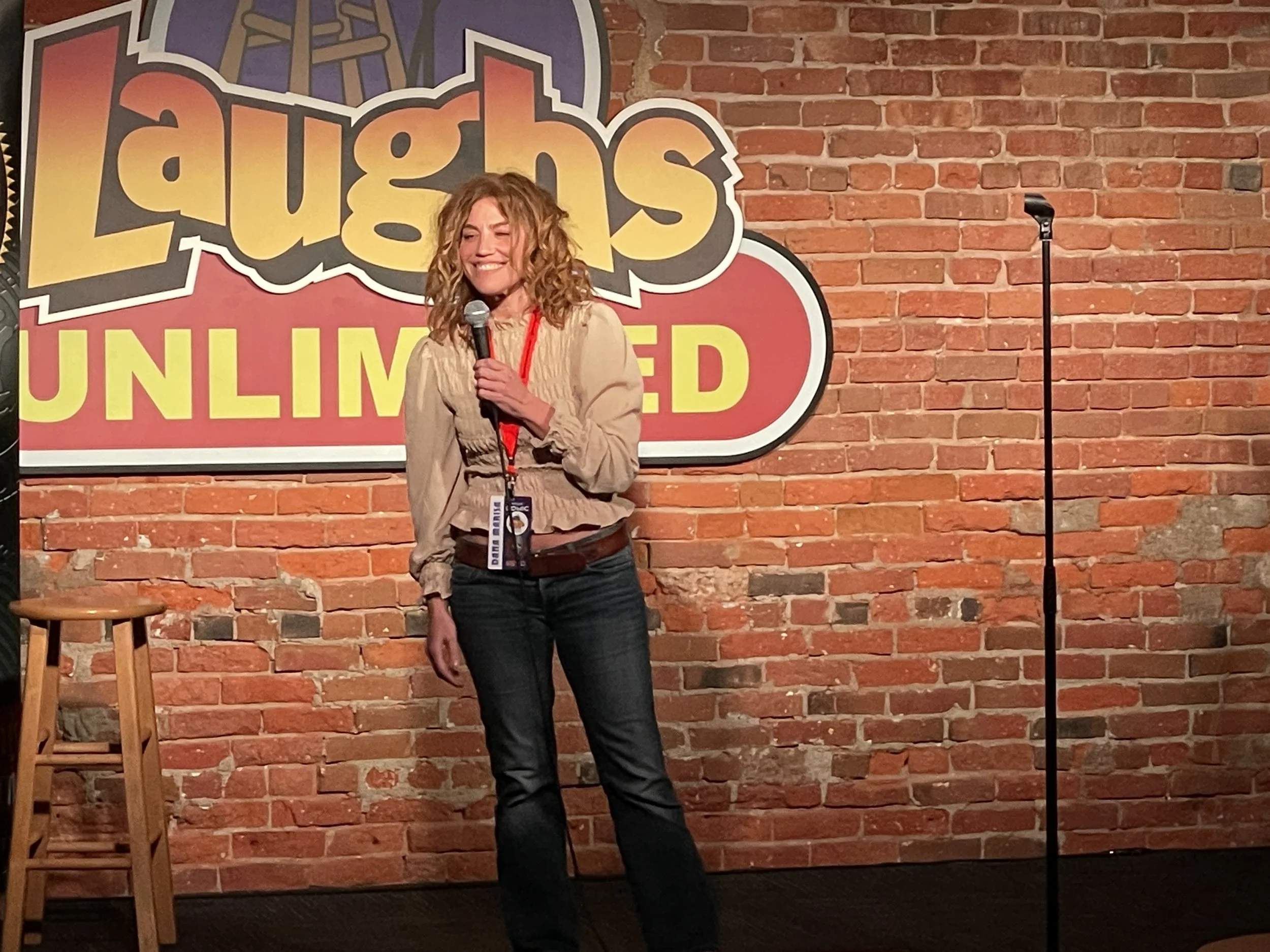 Dana Marisa performing stand-up comedy in Sacramento CA, at the World Series of Comedy