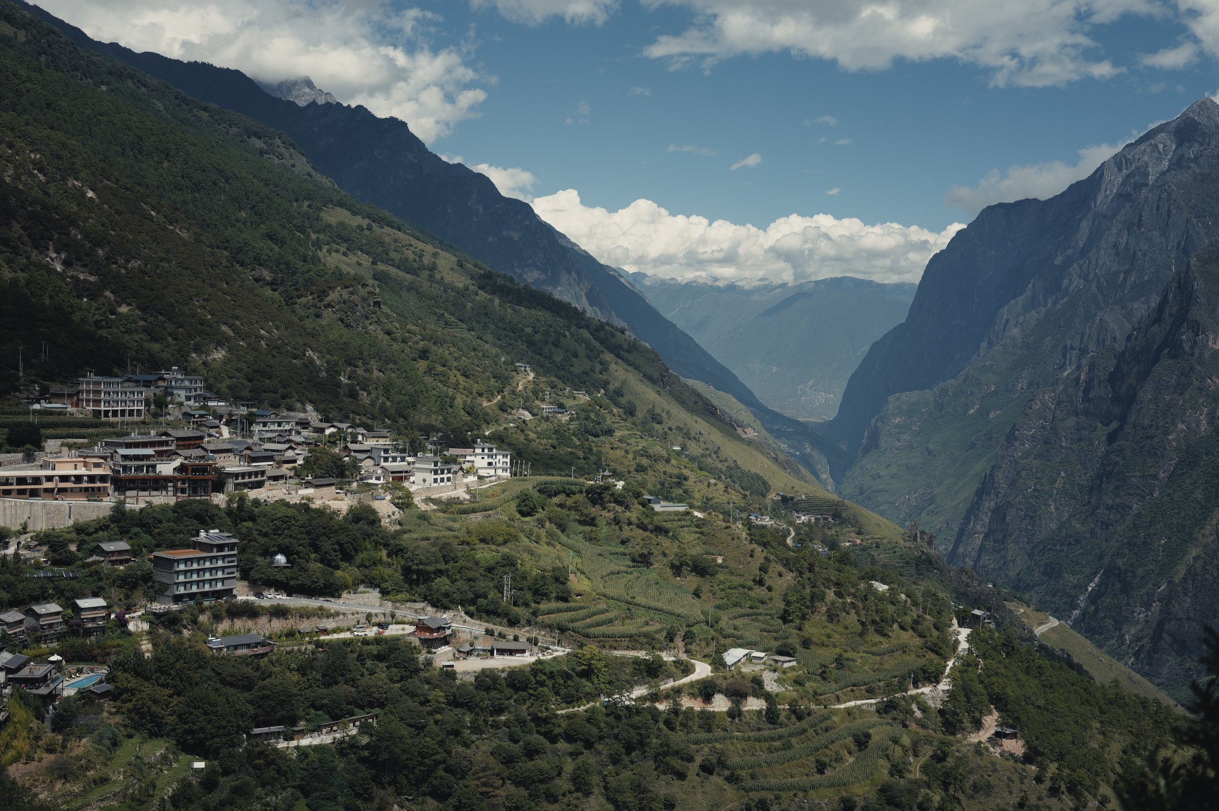 Mountain village beneath cliffs in Tiger Leaping Gorge, photographed with a Leica Q3 43