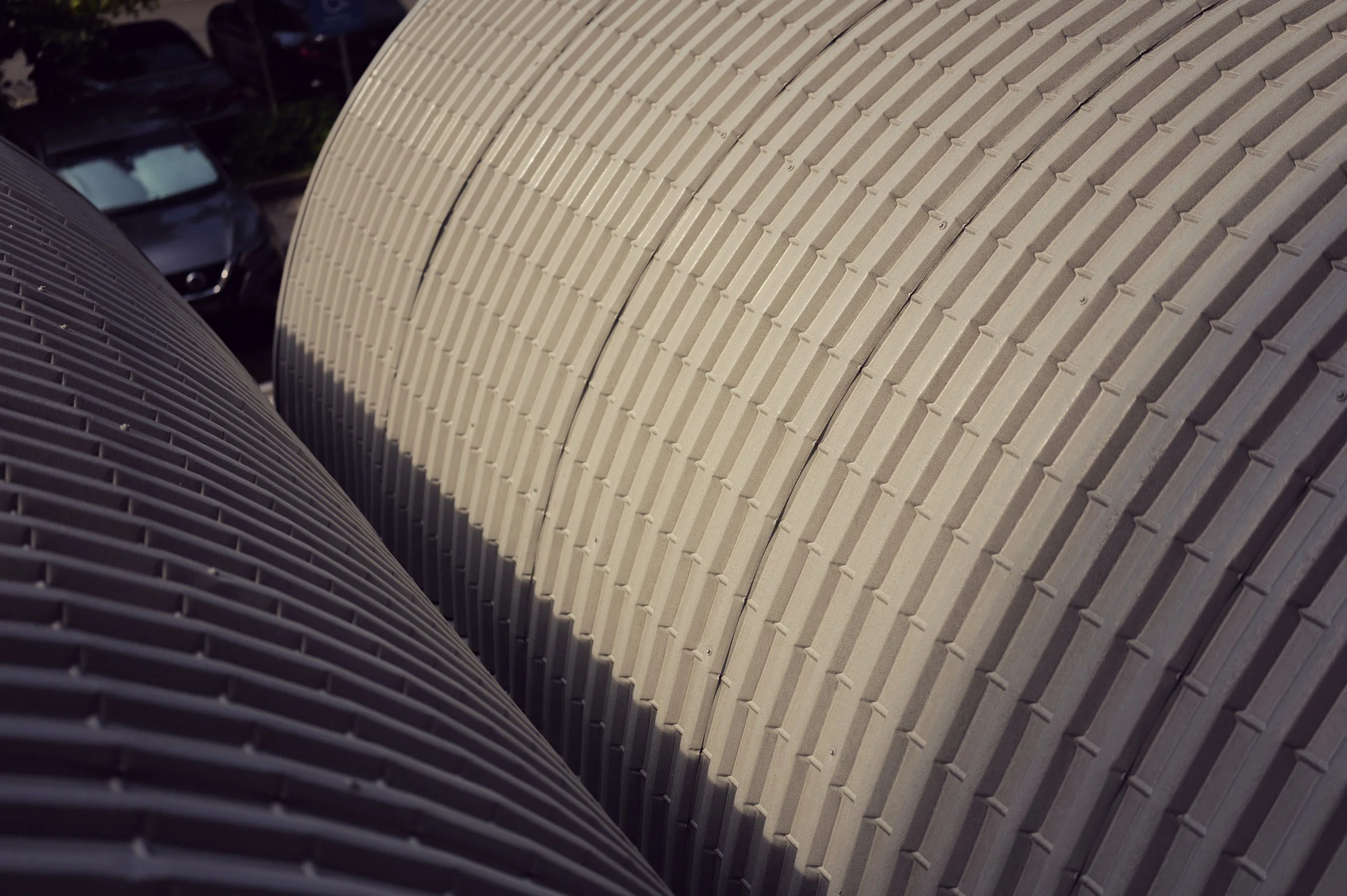 Repeating ribs and curved rooflines seen from above at New Bahru.