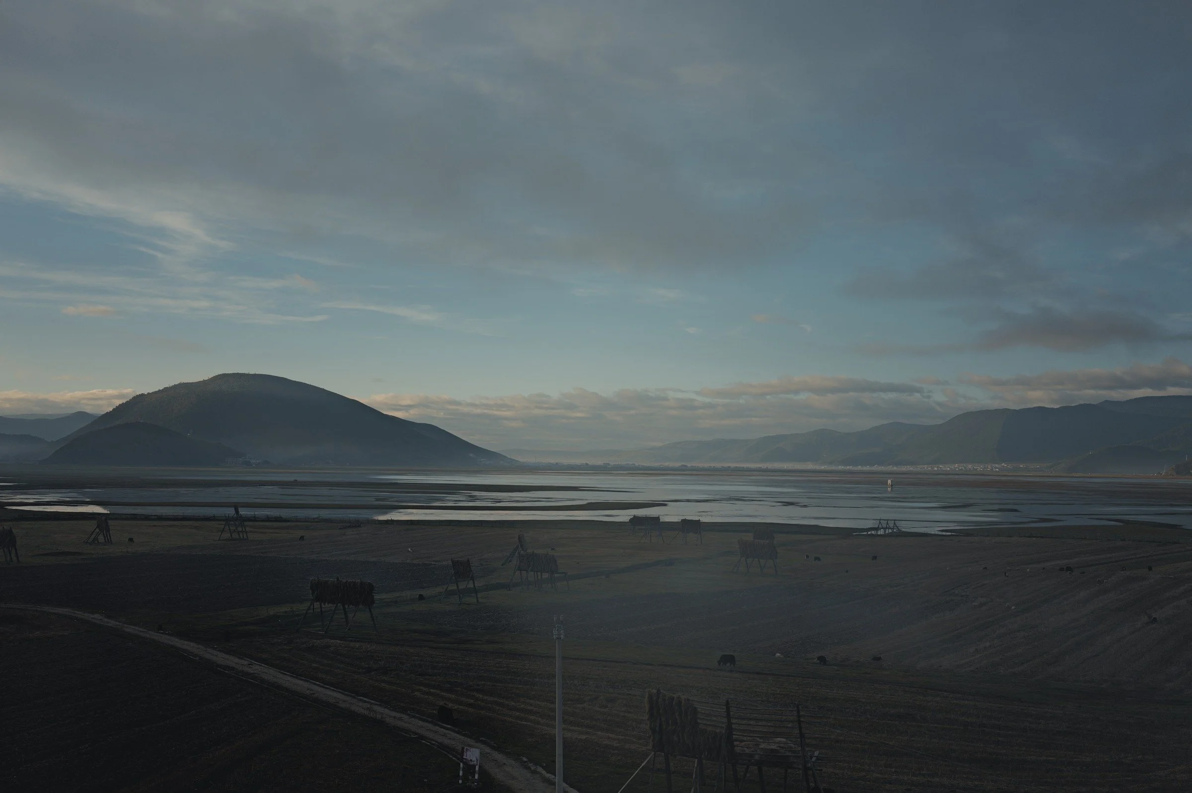 Morning light and cloud over the open landscape at Napa Lake, Shangri-La, Yunnan.