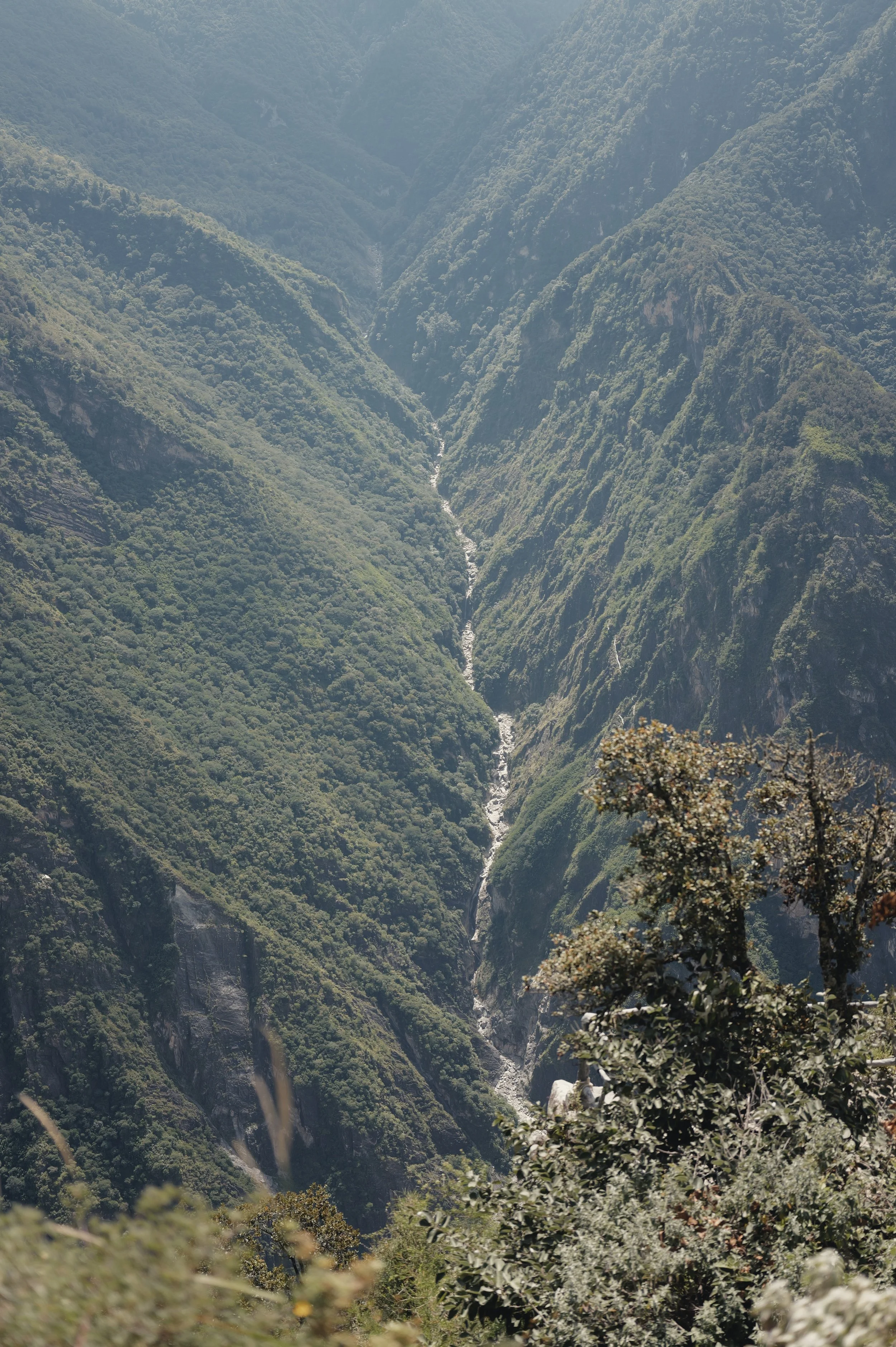 Winding mountain road carved into Tiger Leaping Gorge in Yunnan