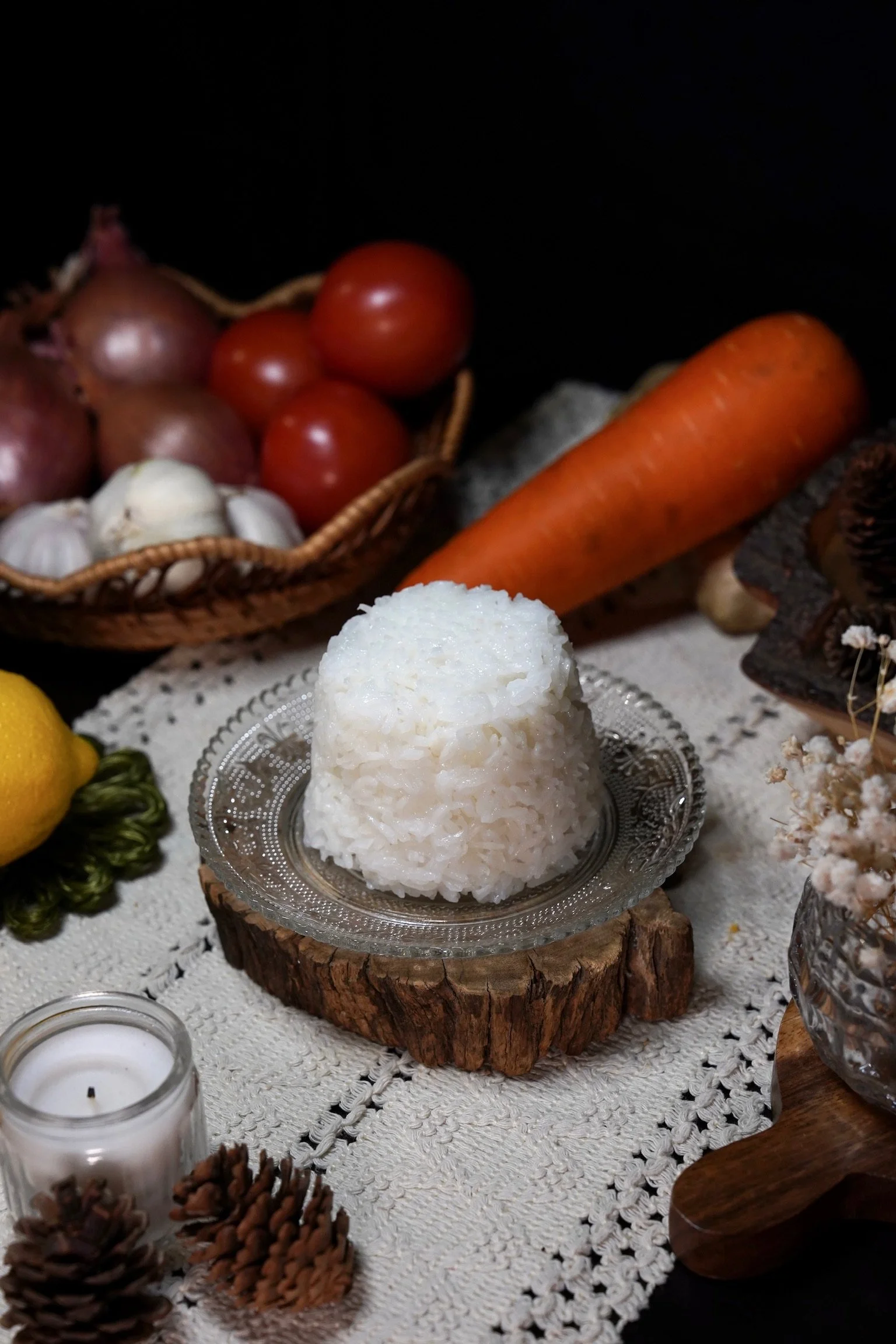 A serving of cooked white rice on a glass plate.