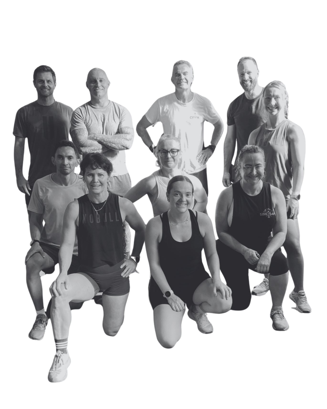 Group of nine people dressed in athletic clothing posing together, some kneeling and some standing, on a fitness or gym setting.
