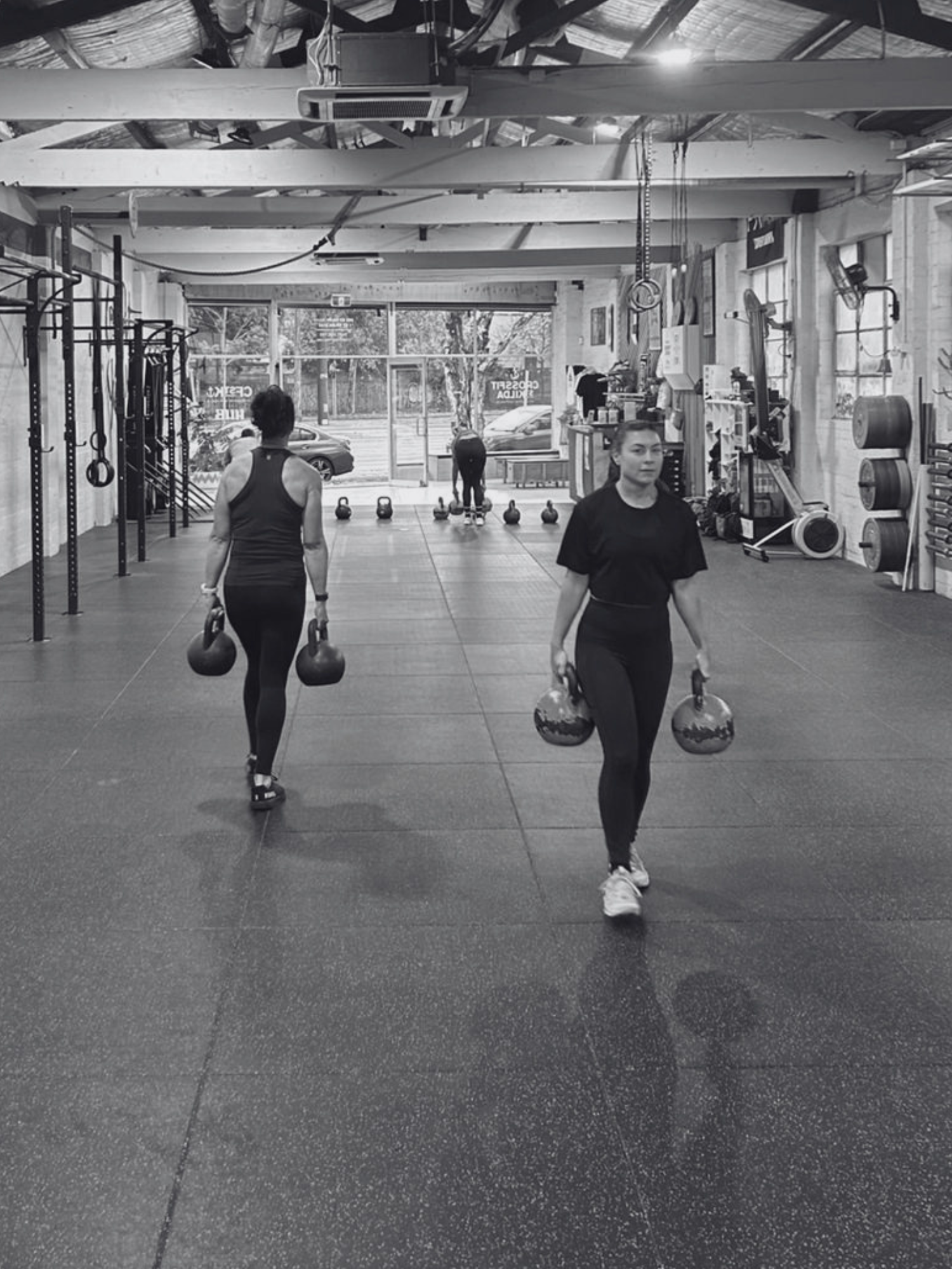 women carrying kettlebells inside crossfit st kilda