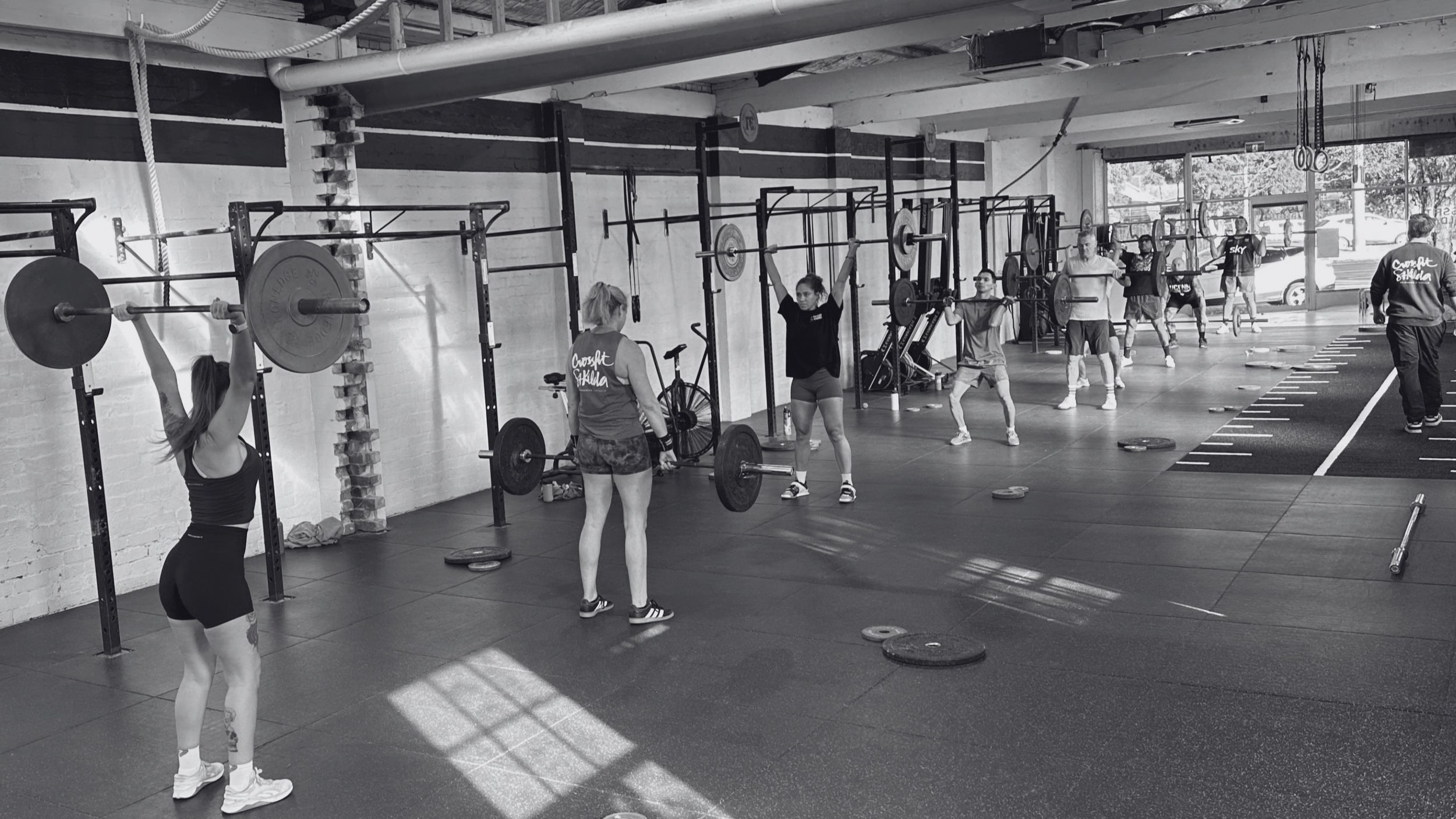 Group class at CrossFit St Kilda completing Gwen 15-12-9 broken clean and jerk