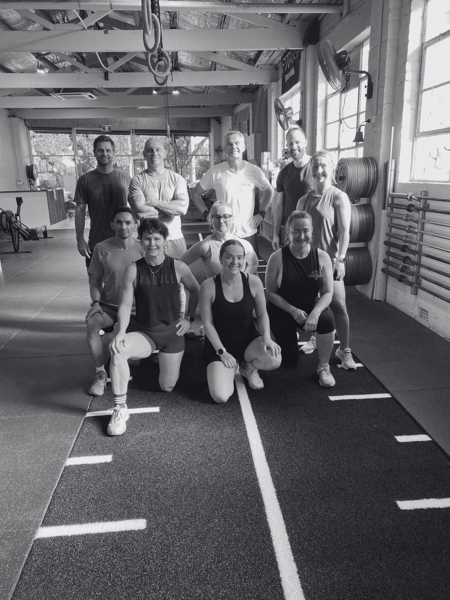 After class photo on sled track inside stance training