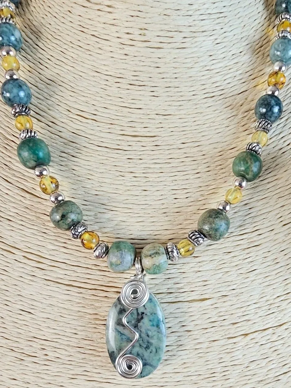 moss-agate-amber-bead-necklace-moss-agate-oval-wire-wrap-pendant-front_ospivx.jpg