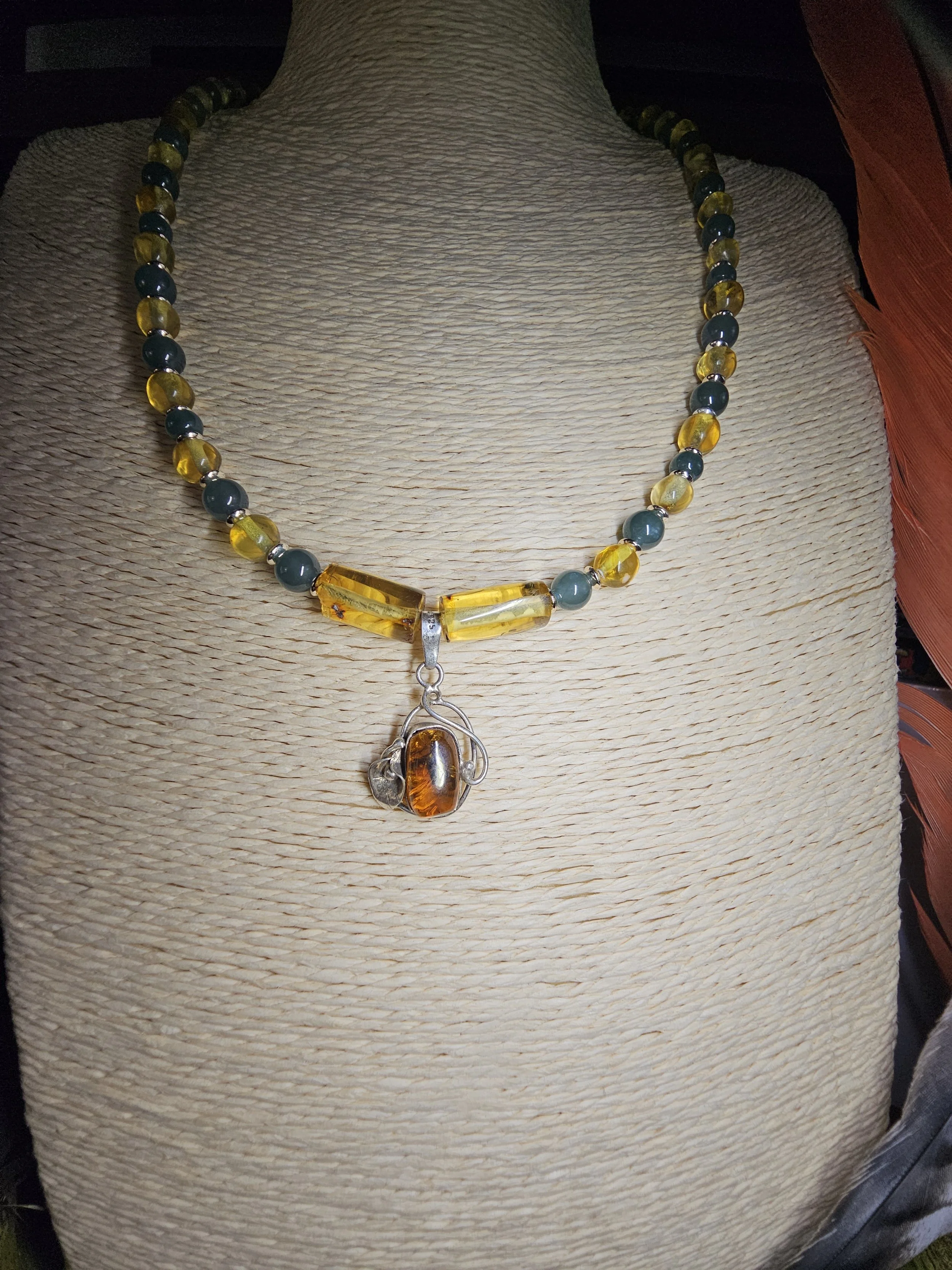 chiapas-amber-jade-bead-necklace-cognac-amber-silver-scroll-pendant-side_tfzkip.jpg