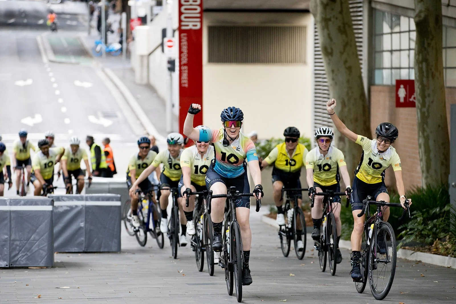 Tour de Cure riders cheering as the peloton rolls through a Sydney street, filmed by Citadel Creative