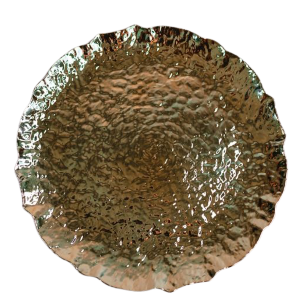A metallic, reflective, circular object with a textured, hammered surface that appears to be a decorative bowl or dish.