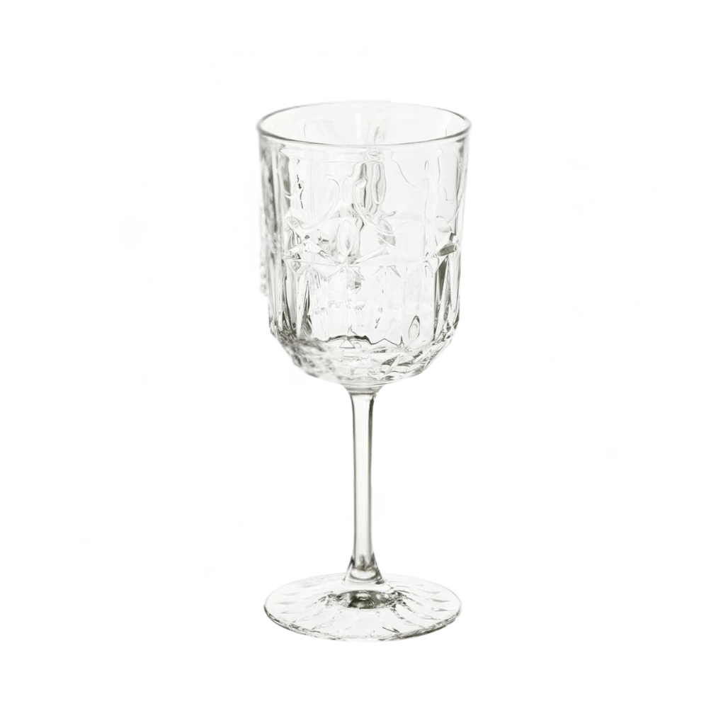 A clear, empty glass with a decorative pattern, standing upright against a white background.