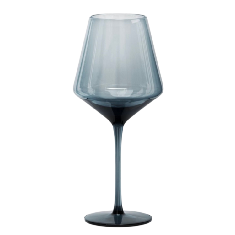 A glass of red wine in a clear, tall wine glass with a slightly tapered bowl.