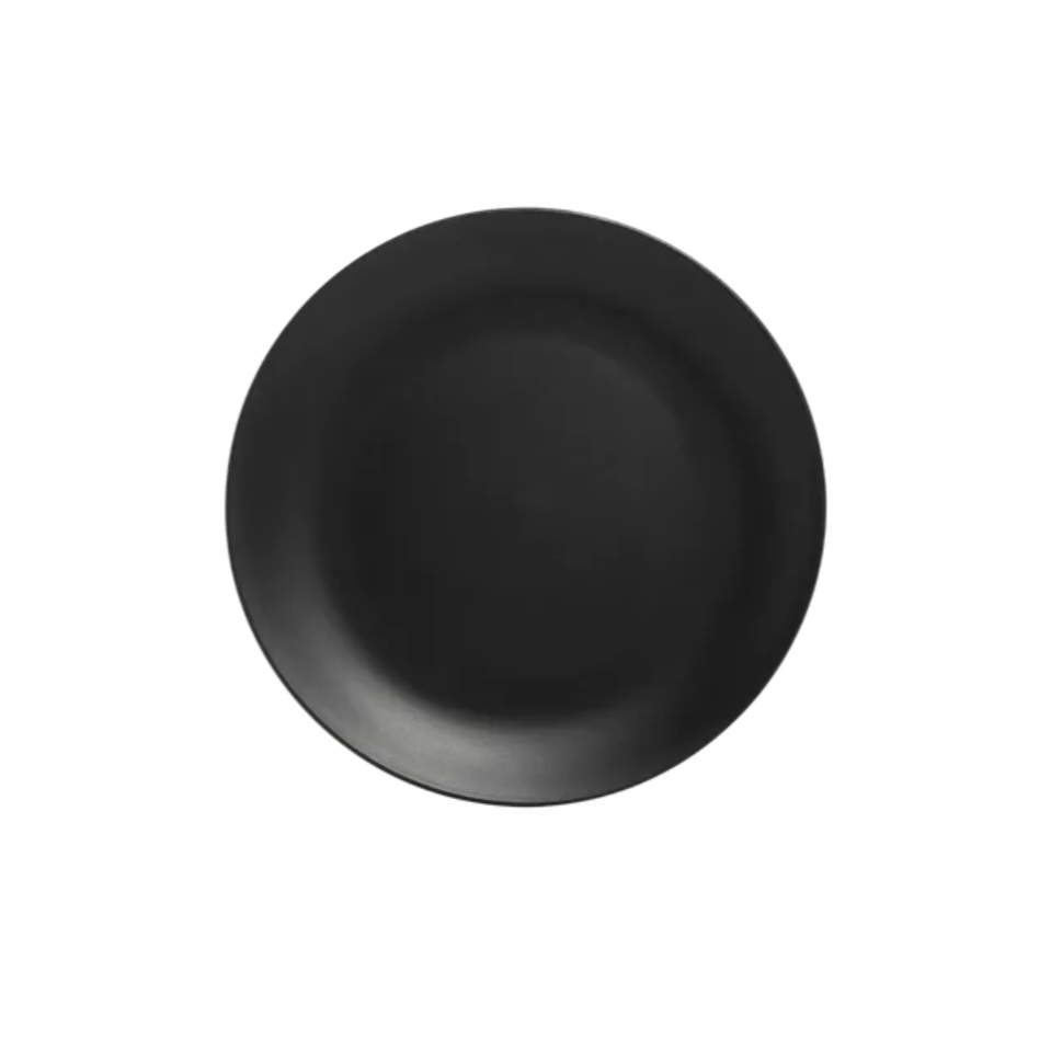 Top view of a black, round ceramic or metal bowl on a white background.