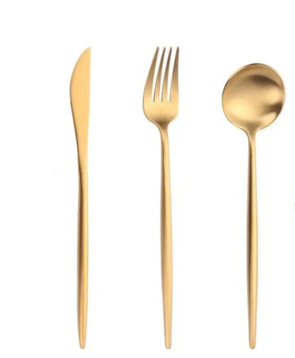 Set of three gold-toned utensils: a knife, a fork, and a spoon, arranged vertically against a white background.