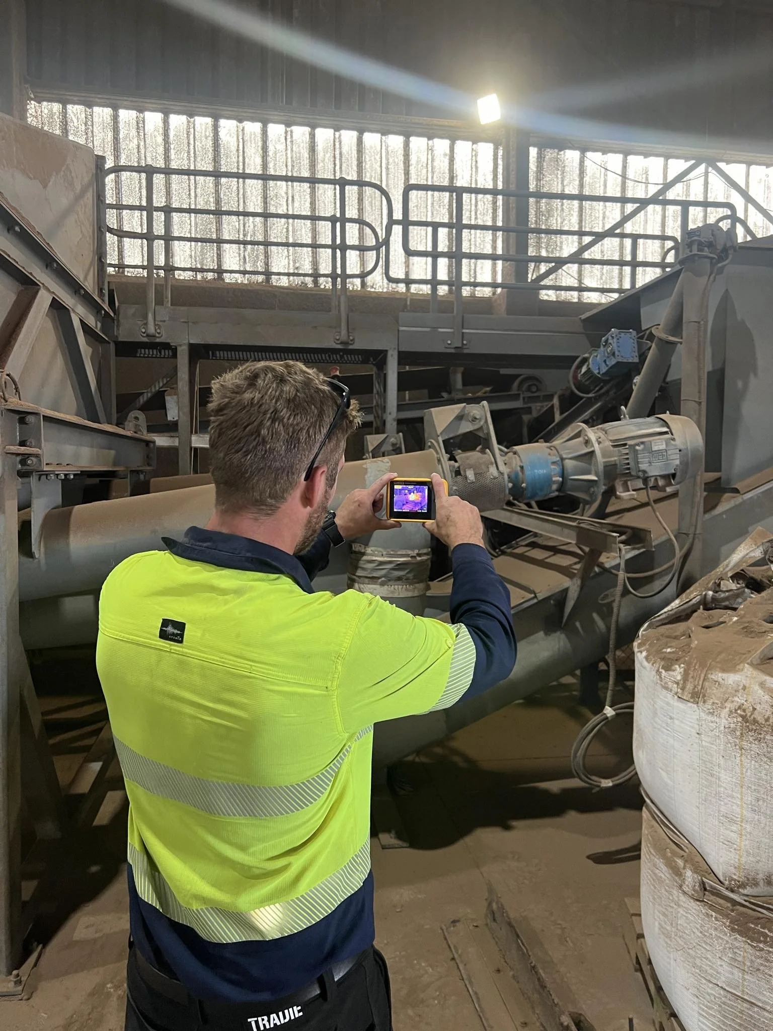 Superior Engineering Group - Employee using scanning testing equipment to identify a problem.
