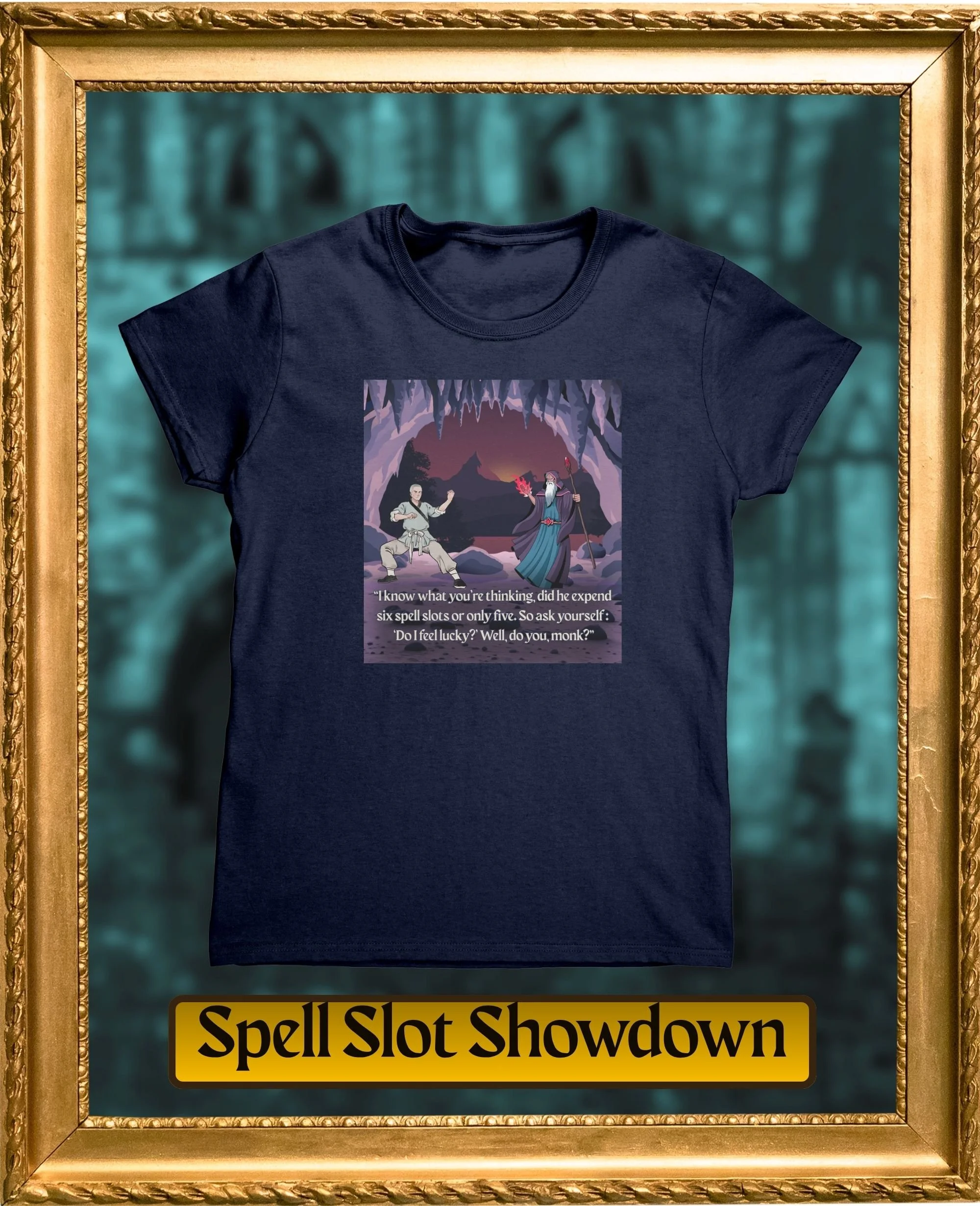A dark blue T-shirt with a graphic of two wizard characters inside a fantasy landscape with purple caves and mountains, and a text box below that says "Spell Slot Showdown." The shirt is displayed within a gold ornate frame with a blurred greenish forest background and a yellow sign at the bottom that says "Spell Slot Showdown."