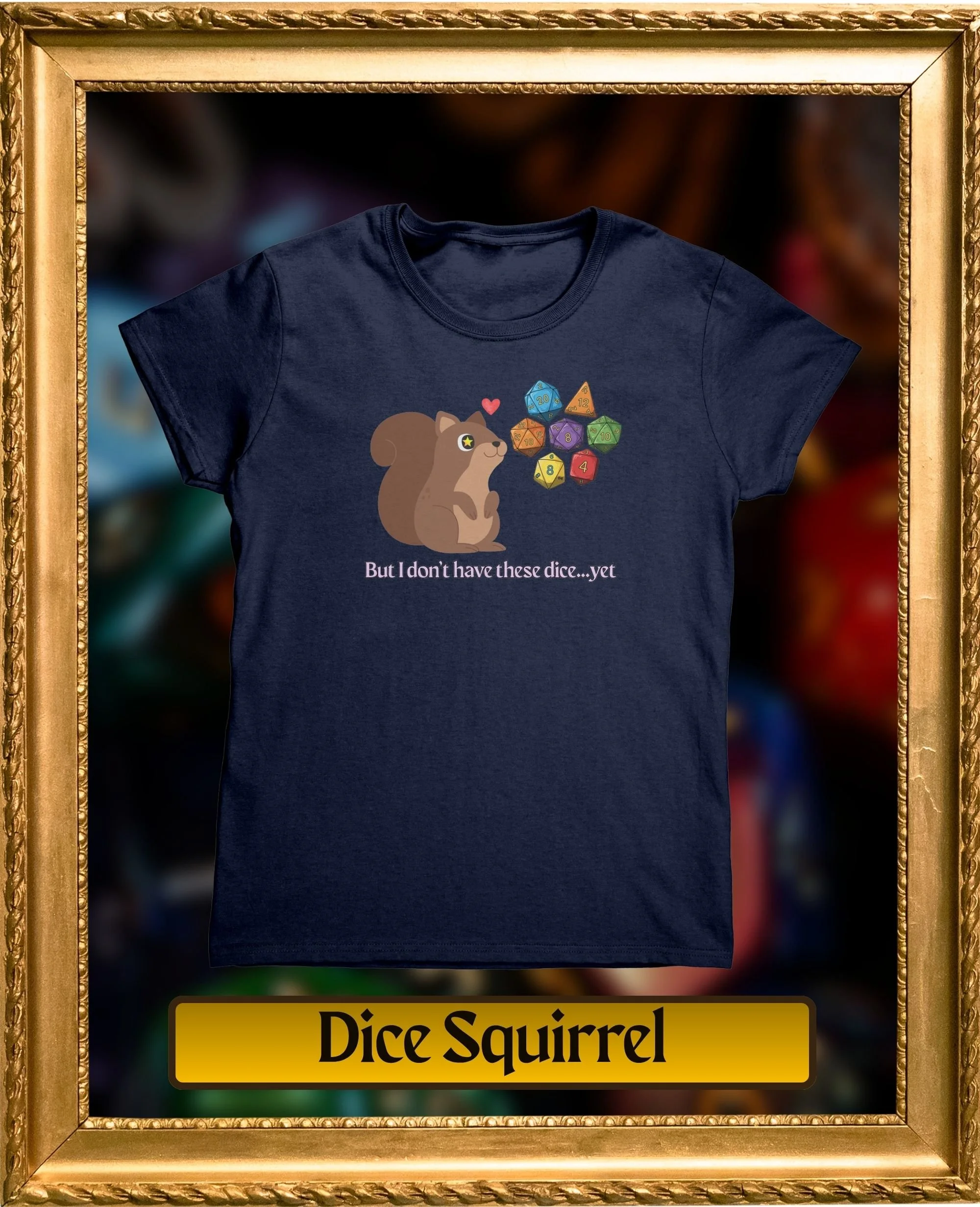 A navy blue t-shirt with a graphic of a squirrel holding dice and a red heart above its head. The text below the graphic reads, "Dice Squirrel."