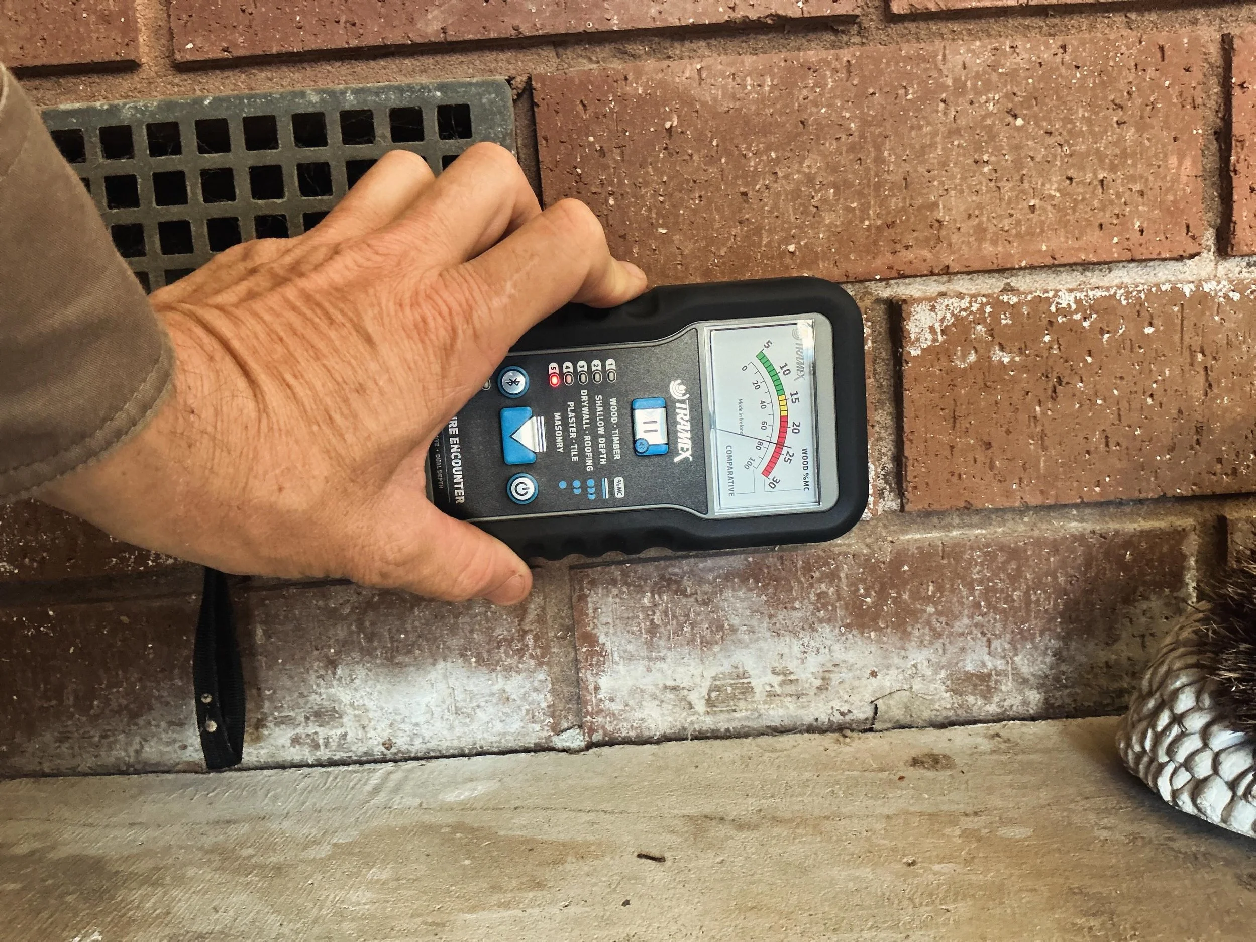 Efflorescence and elevated moisture readings identified to lower brickwork during an inspection.
Efflorescence is the white powdery deposit sometimes seen on masonry surfaces and is often associated with excess moisture movement through the wall. Pho