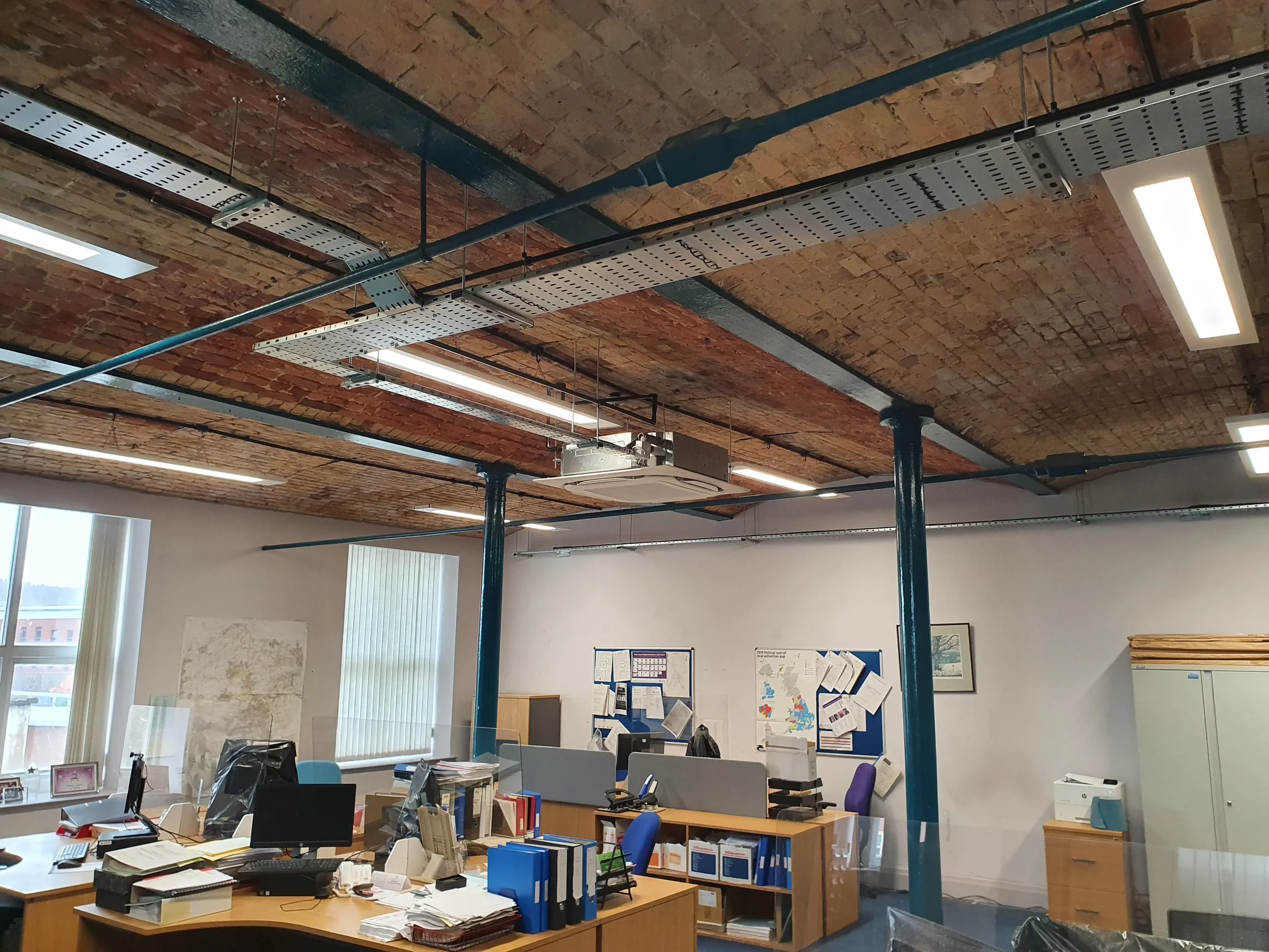 Exposed ceiling with exposed brick and ductwork inside Scaitcliffe House, Hyndburn Borough Council, following a Salvis decarbonisation project