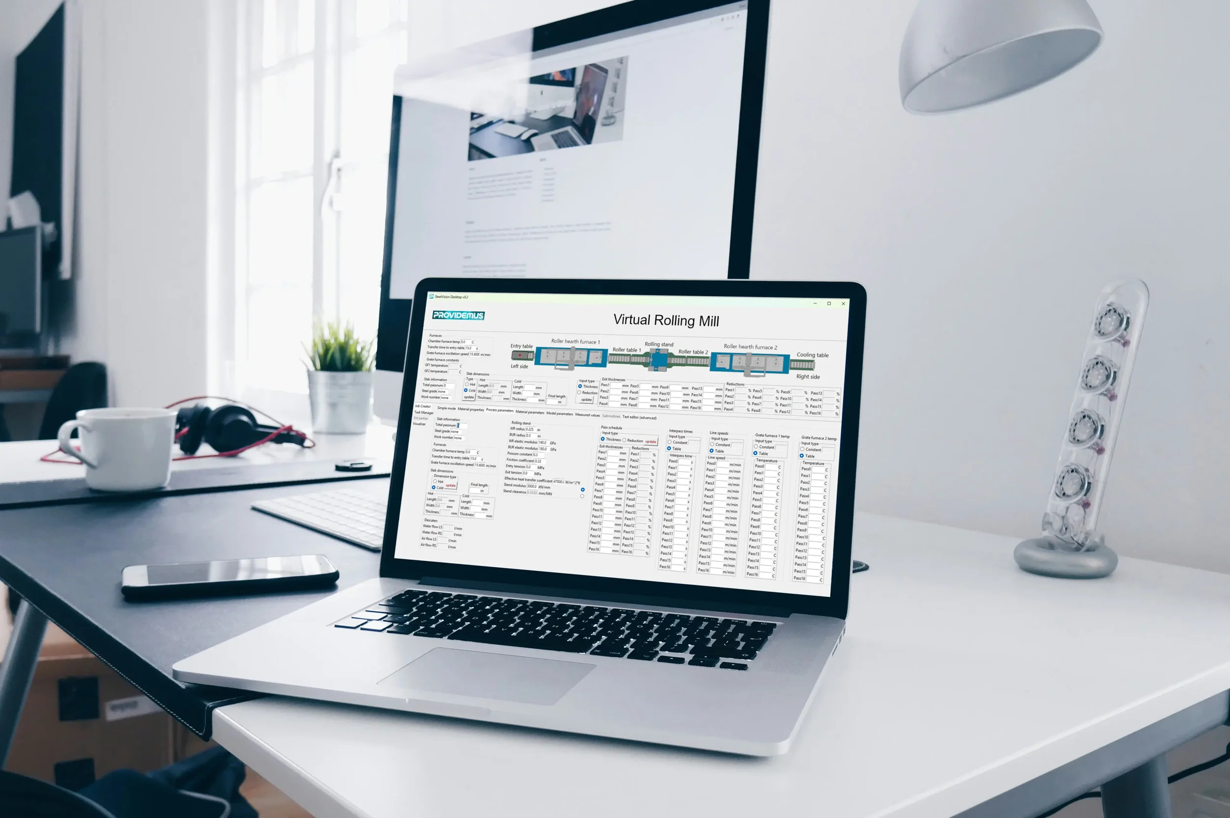 A laptop on a desk showing the Providemus' user interface.