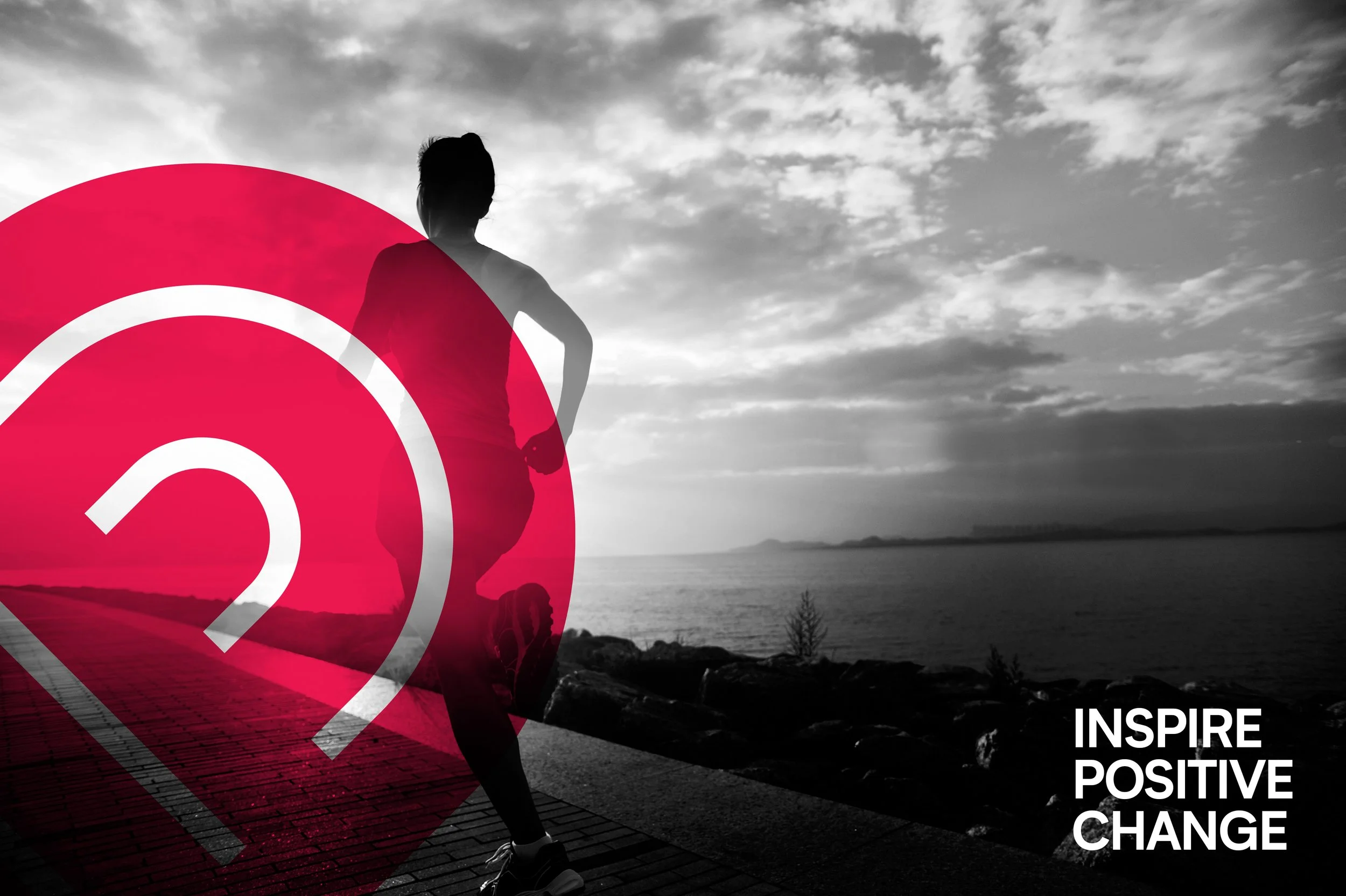 A person standing outdoors on a boardwalk near water, with a cloudy sky in the background. The image has a red circular graphic overlay and white motivational text that reads, 'INSPIRE POSITIVE CHANGE.'